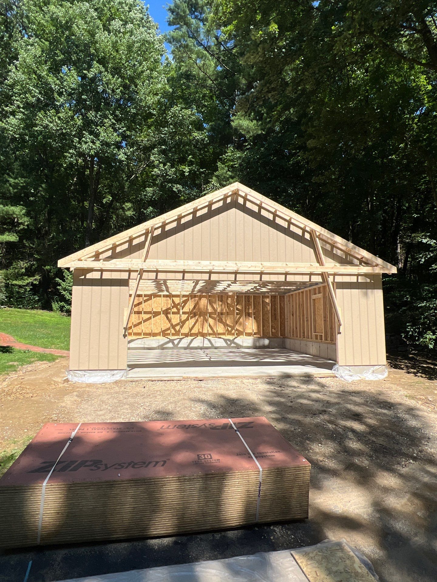 Garage using LP SmartSide Panel Siding by Chagnon Building & Remodeling LLC