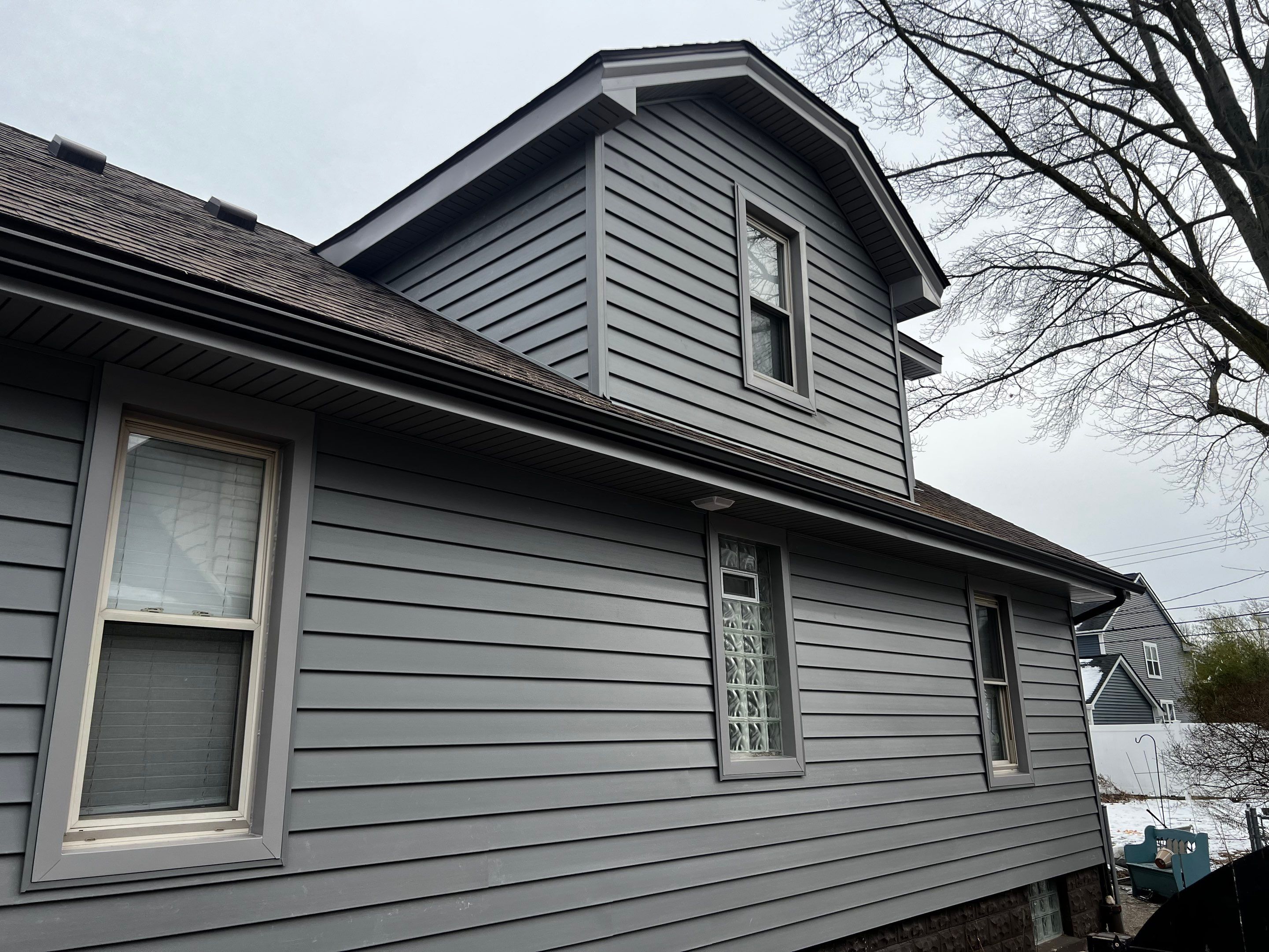 Vinyl Siding Replacement by Bloomfield Construction & Restoration
