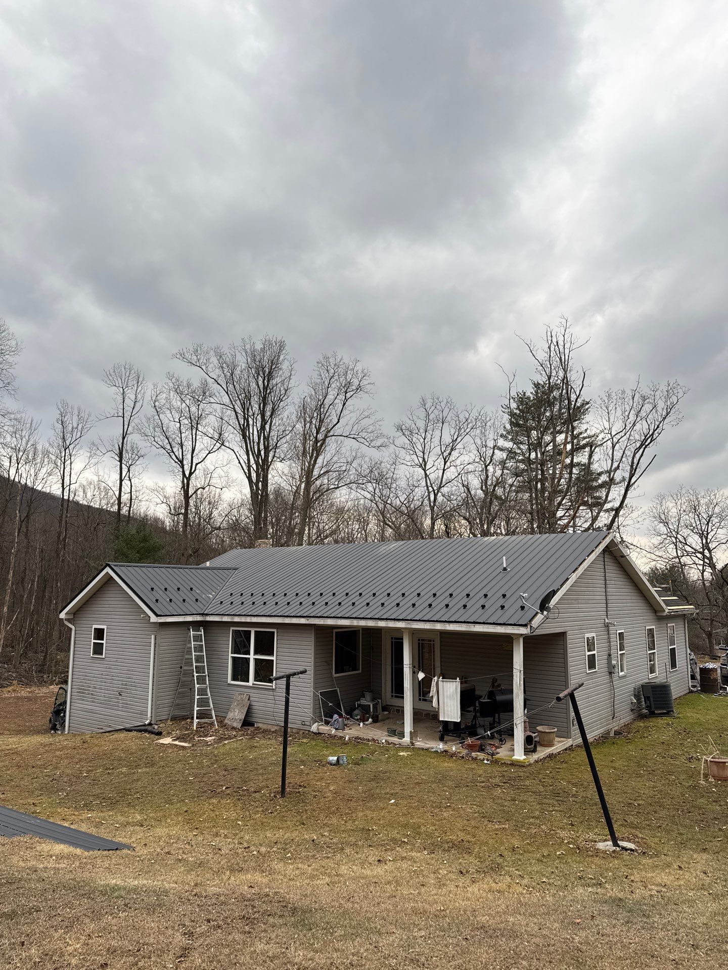 Black Metal Roof Replacement and Gutter Installation in Halifax by Esh Builders
