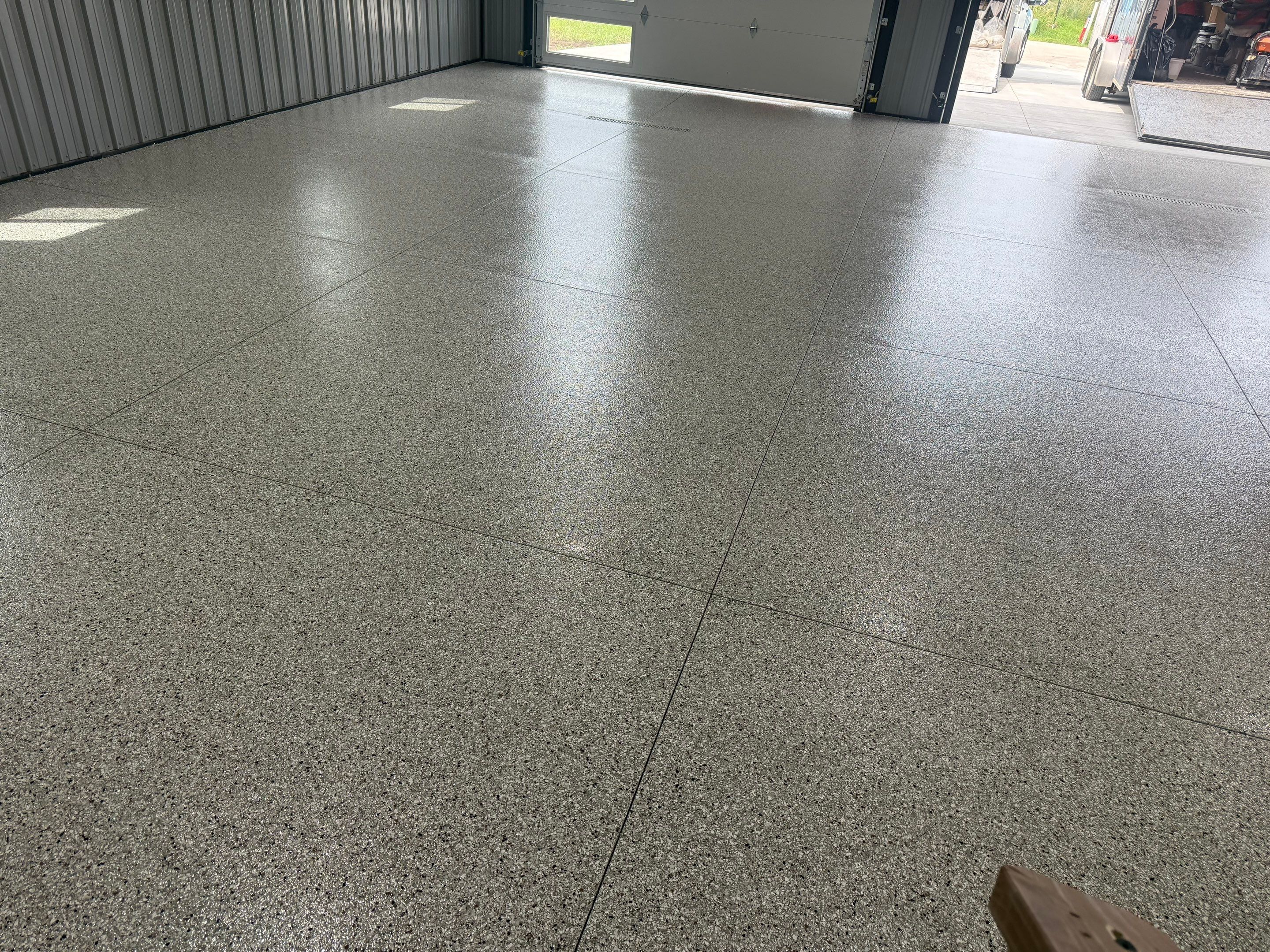 Polyaspartic Garage Floor Coating with Decorative Flake in Wentworth by Select Painting, Coatings & Garage Cabinets