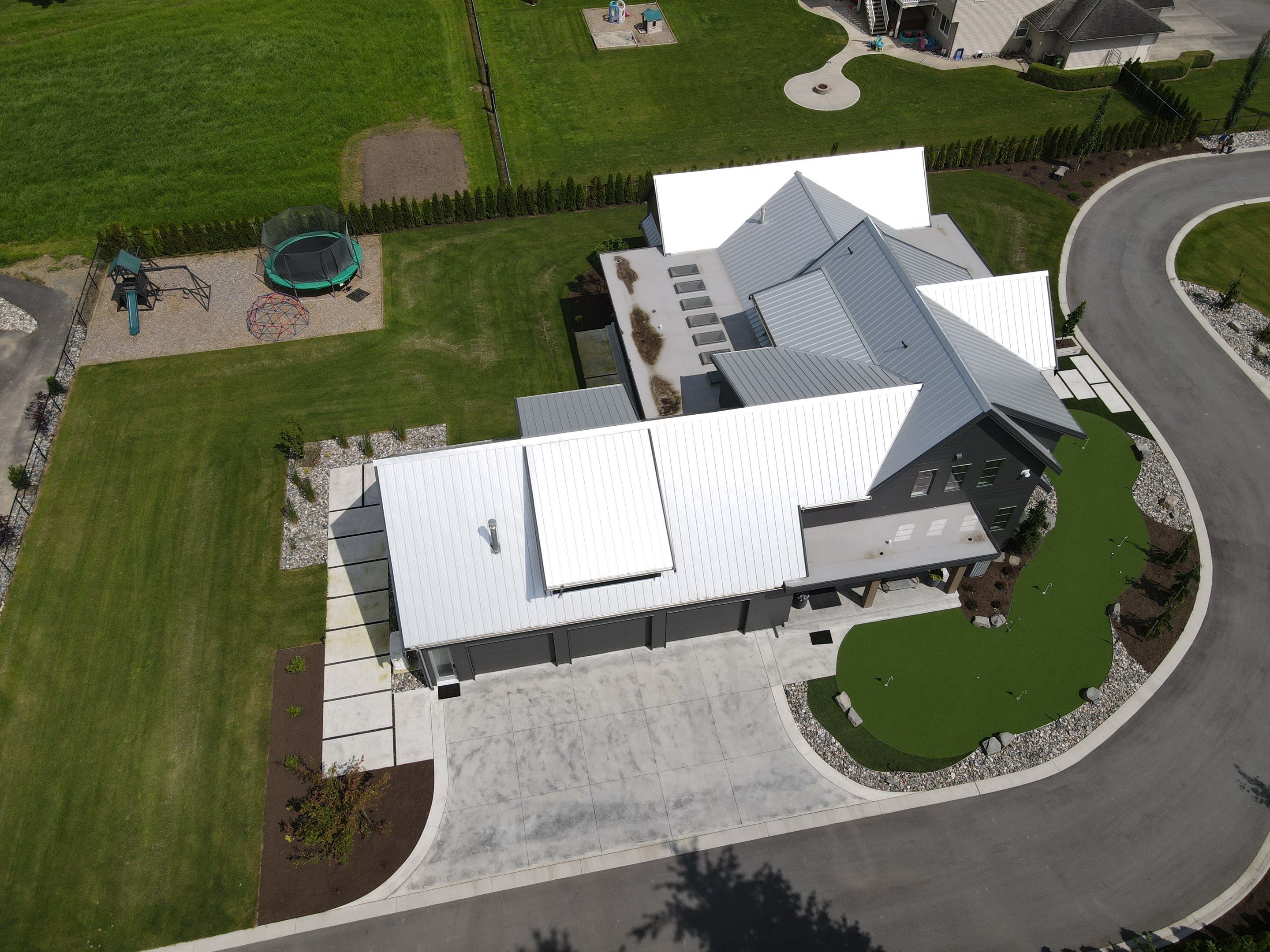 Residential Roofing Installation using 12" Prolok metal  by Top Notch Roofing Inc