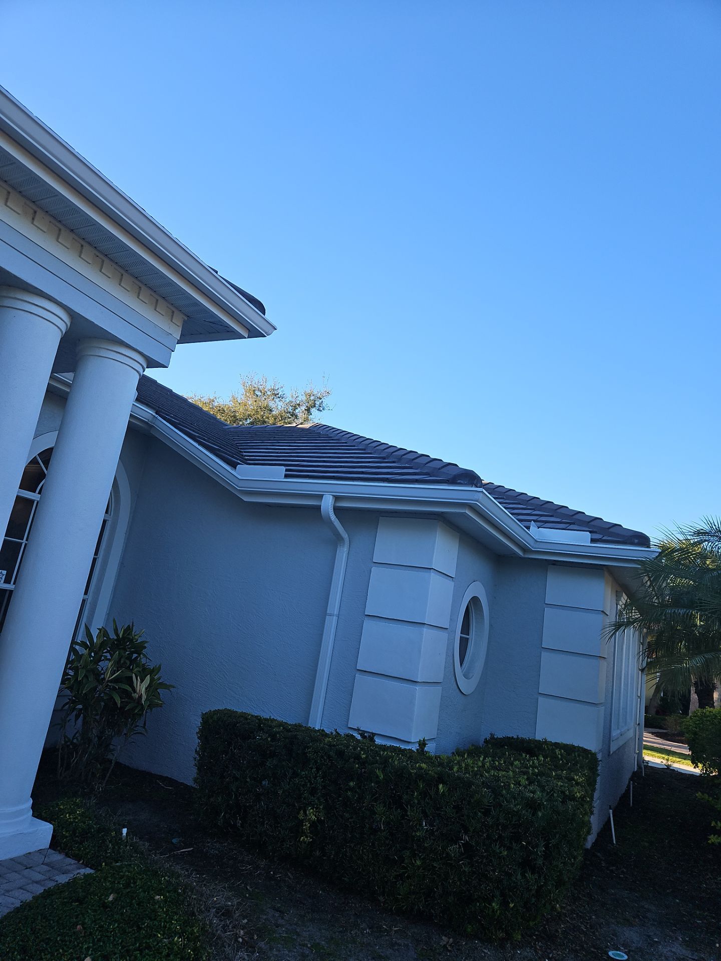 White Down Spouts using downspouts and White Seamless Gutters in Sarasota FL by Gutter Professors