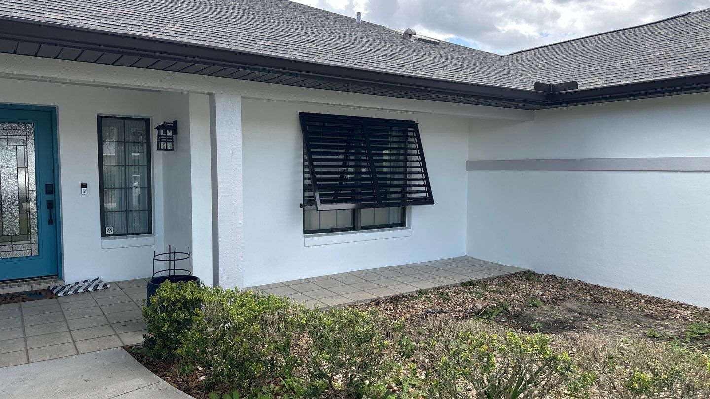 Bahama Shutters in Grey Brown by Smart Guard Shutters