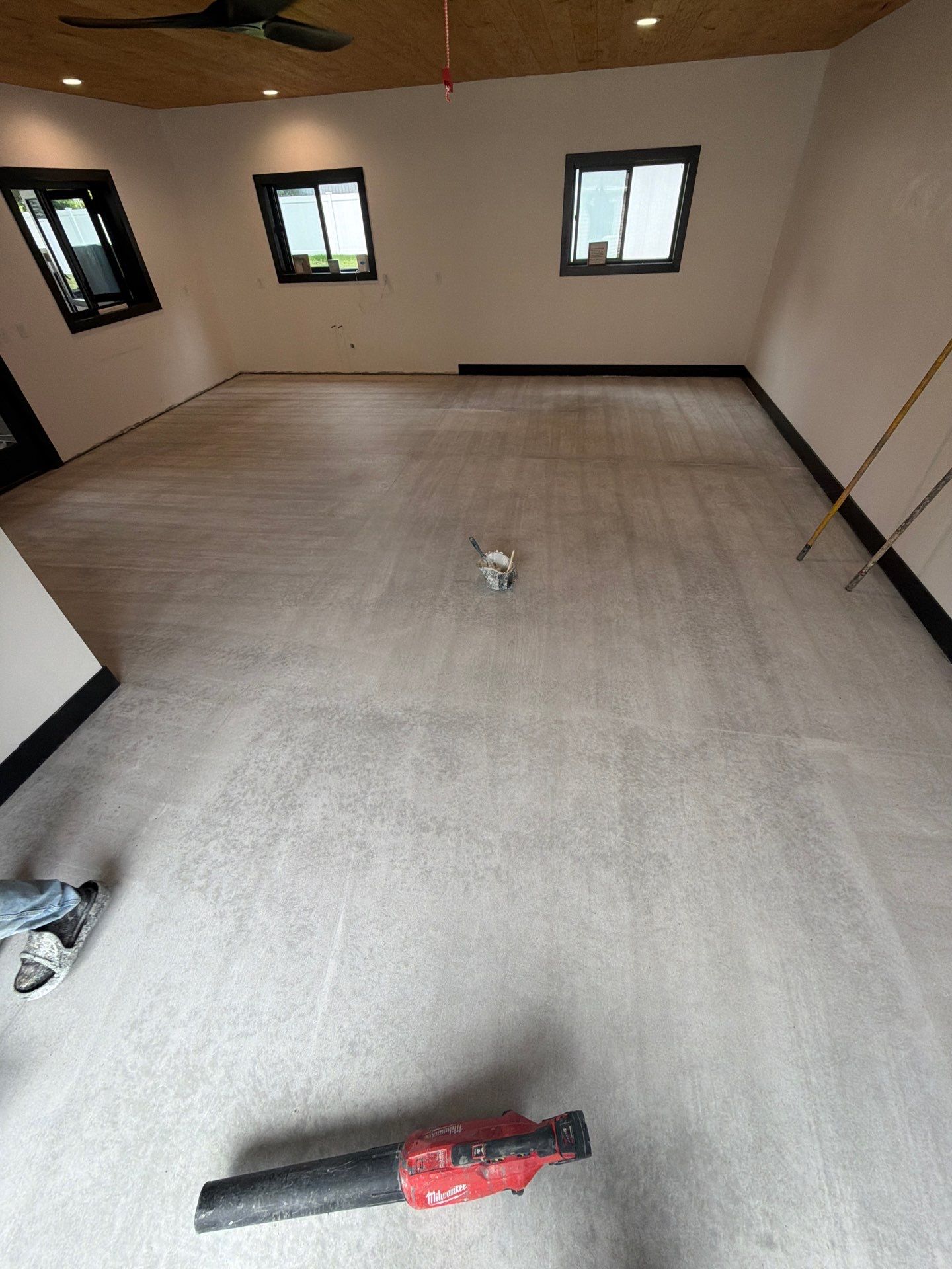 Multi-Room Epoxy Flake Floor Installation Throughout Pentwater Residence by Gordon Painting