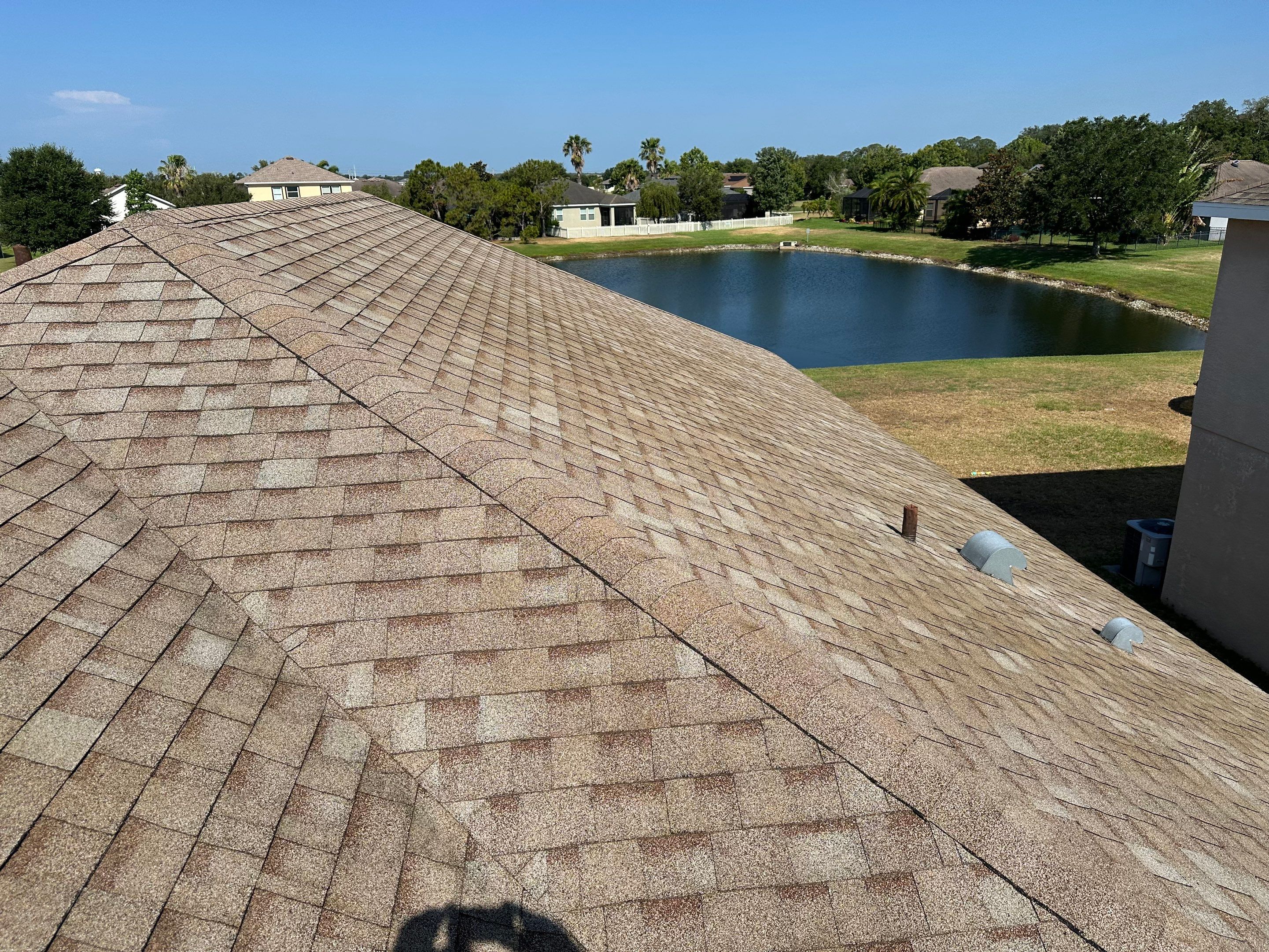 Asphalt Shingle Roof Soft Wash Cleaning & Concrete Pressure Washing in CopperStone Community, Parrish, FL by Sunshine AquaWash