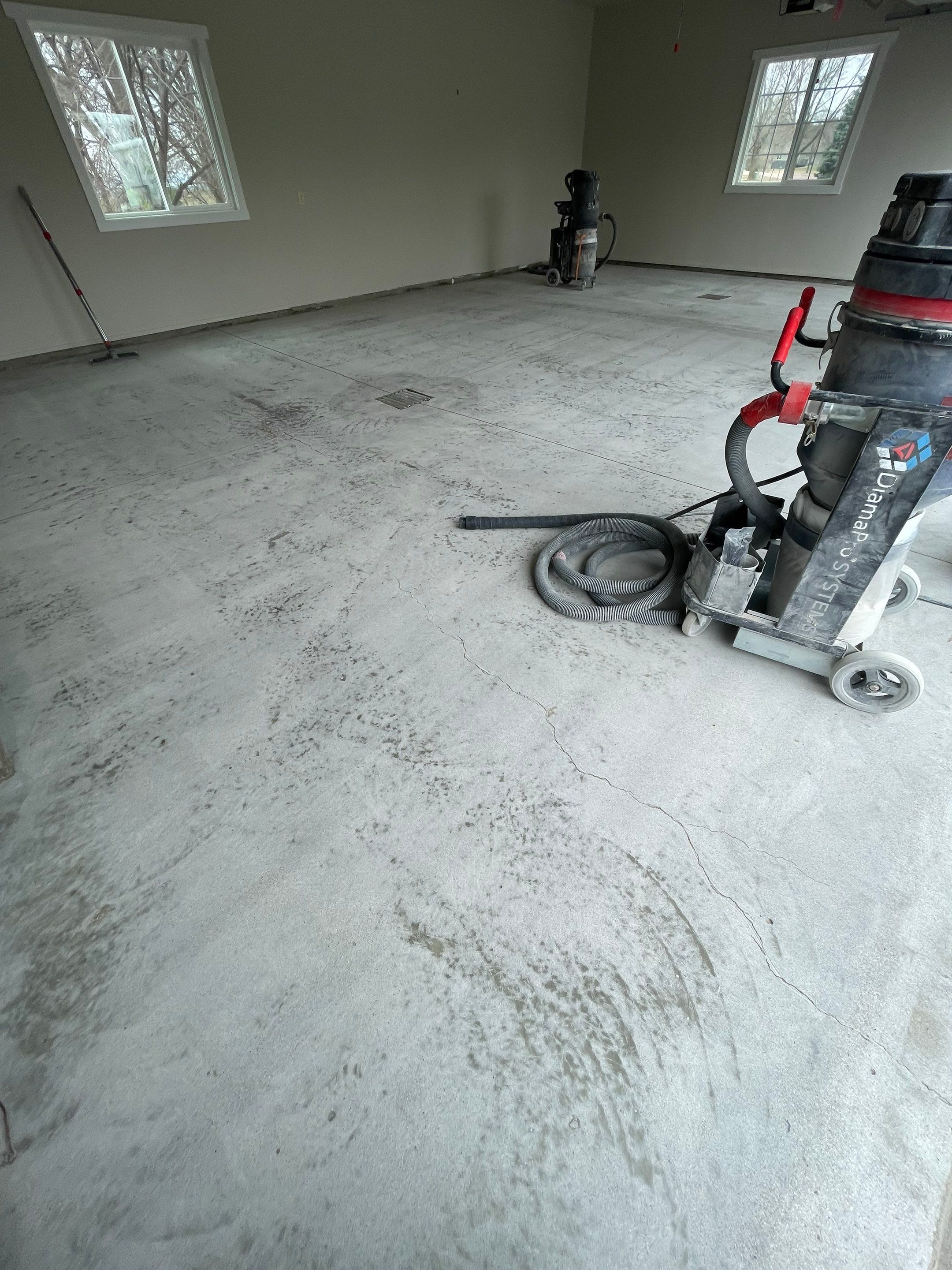 Garage transformation in Yankton by Select Painting, Coatings & Garage Cabinets
