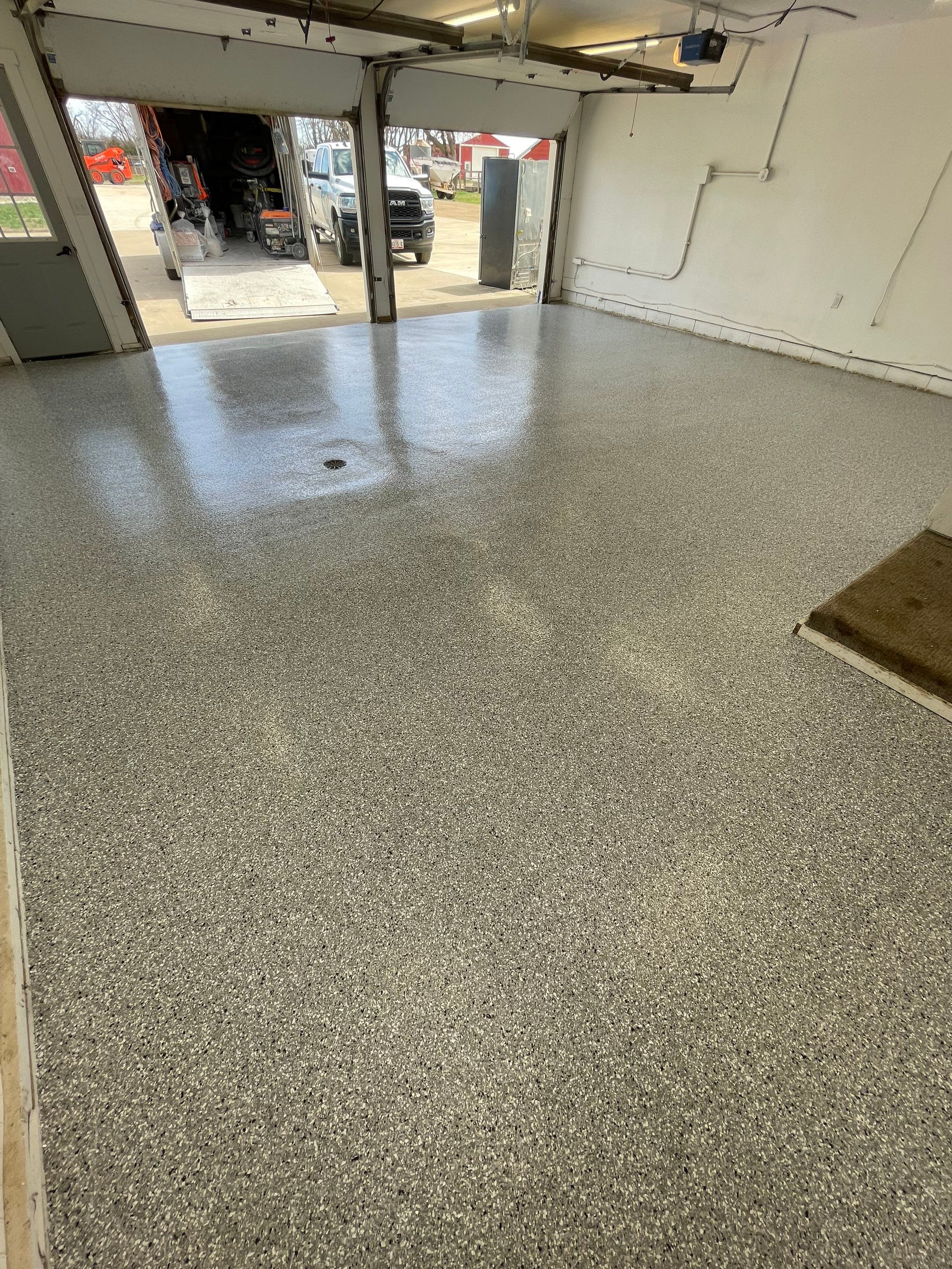 Feather Grey Garage Floor Coating and Crack Repair in Beresford by Select Painting, Coatings & Garage Cabinets
