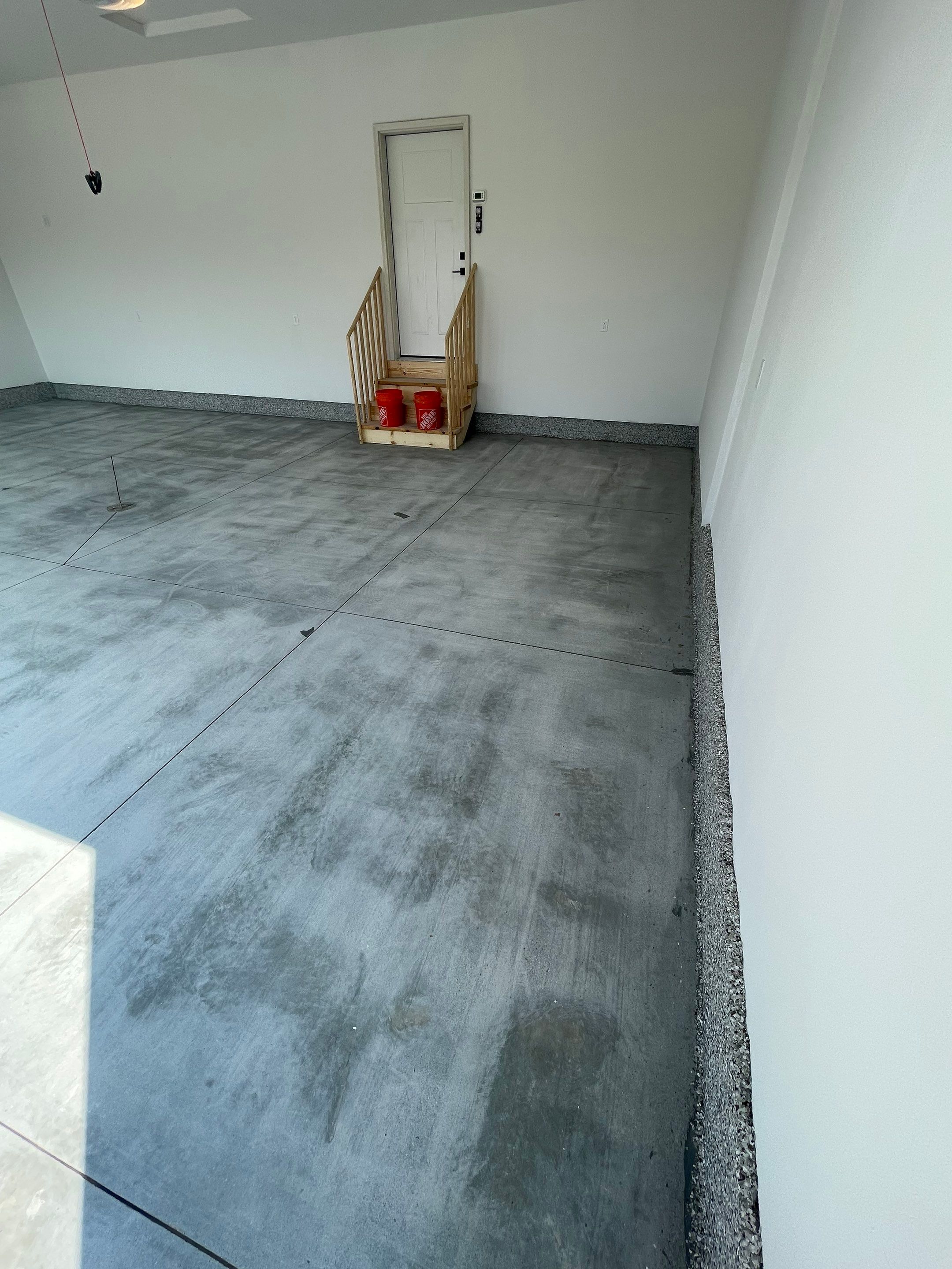 Grey Speckled Garage Floor Coating in Sioux Falls by Select Painting, Coatings & Garage Cabinets