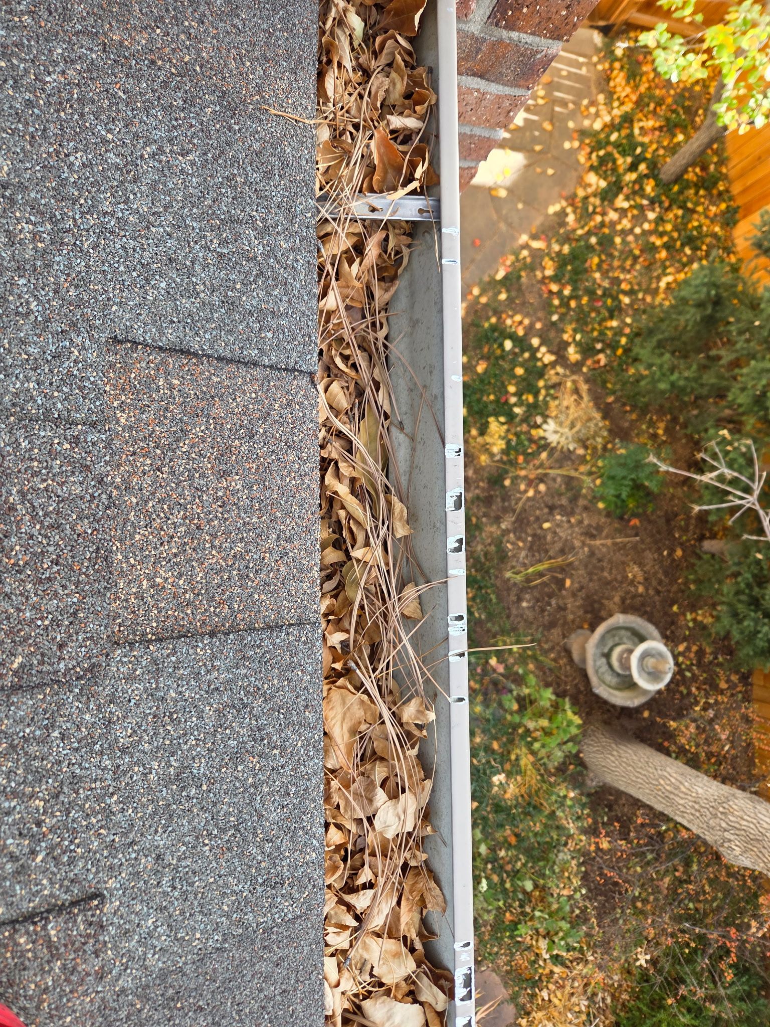 Gutter and Downspout Cleaning by RTP Roofing Company