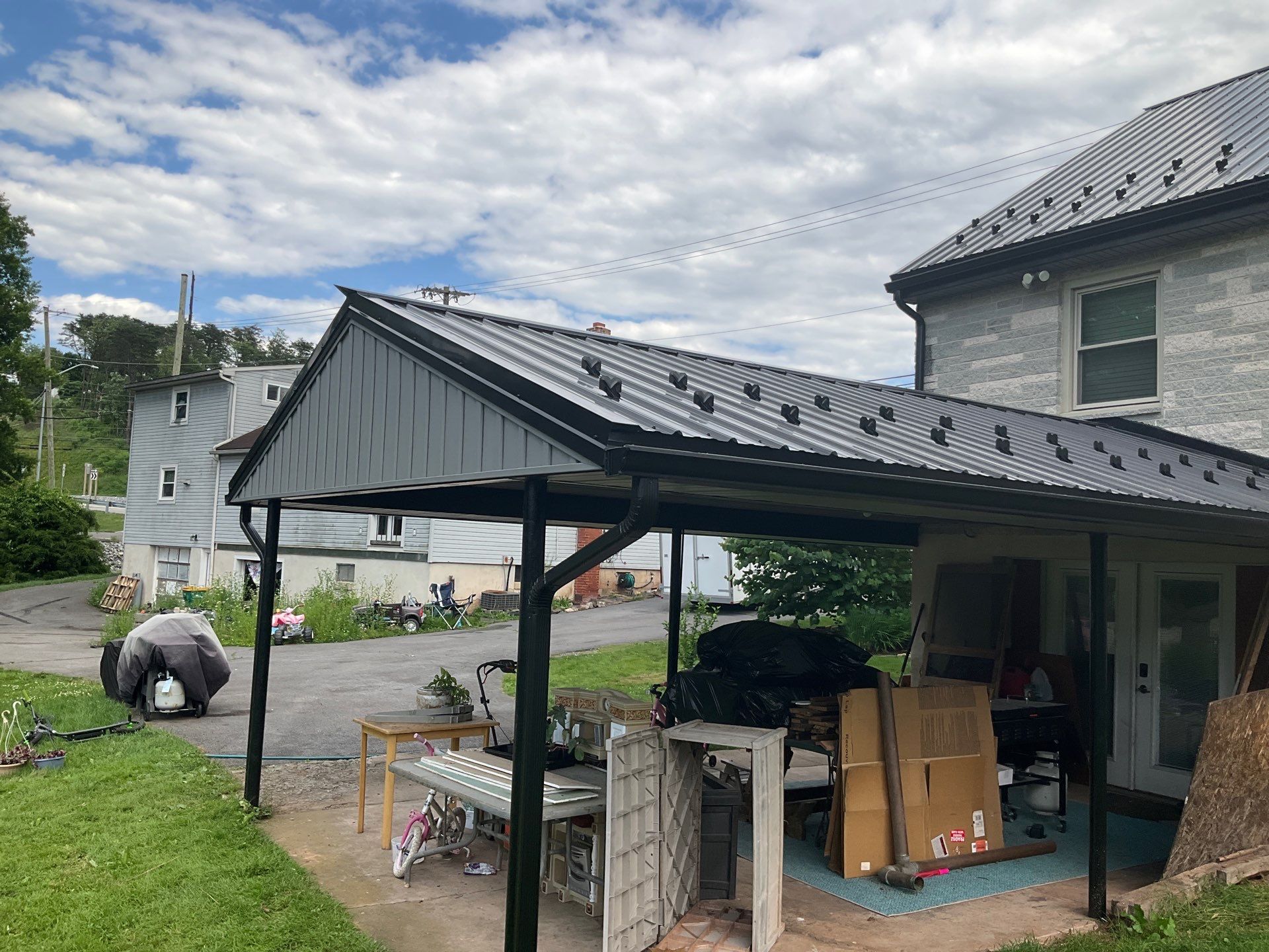 Metal Roofing, Board & Batten Siding, and Entry Door Transformation by Esh Builders