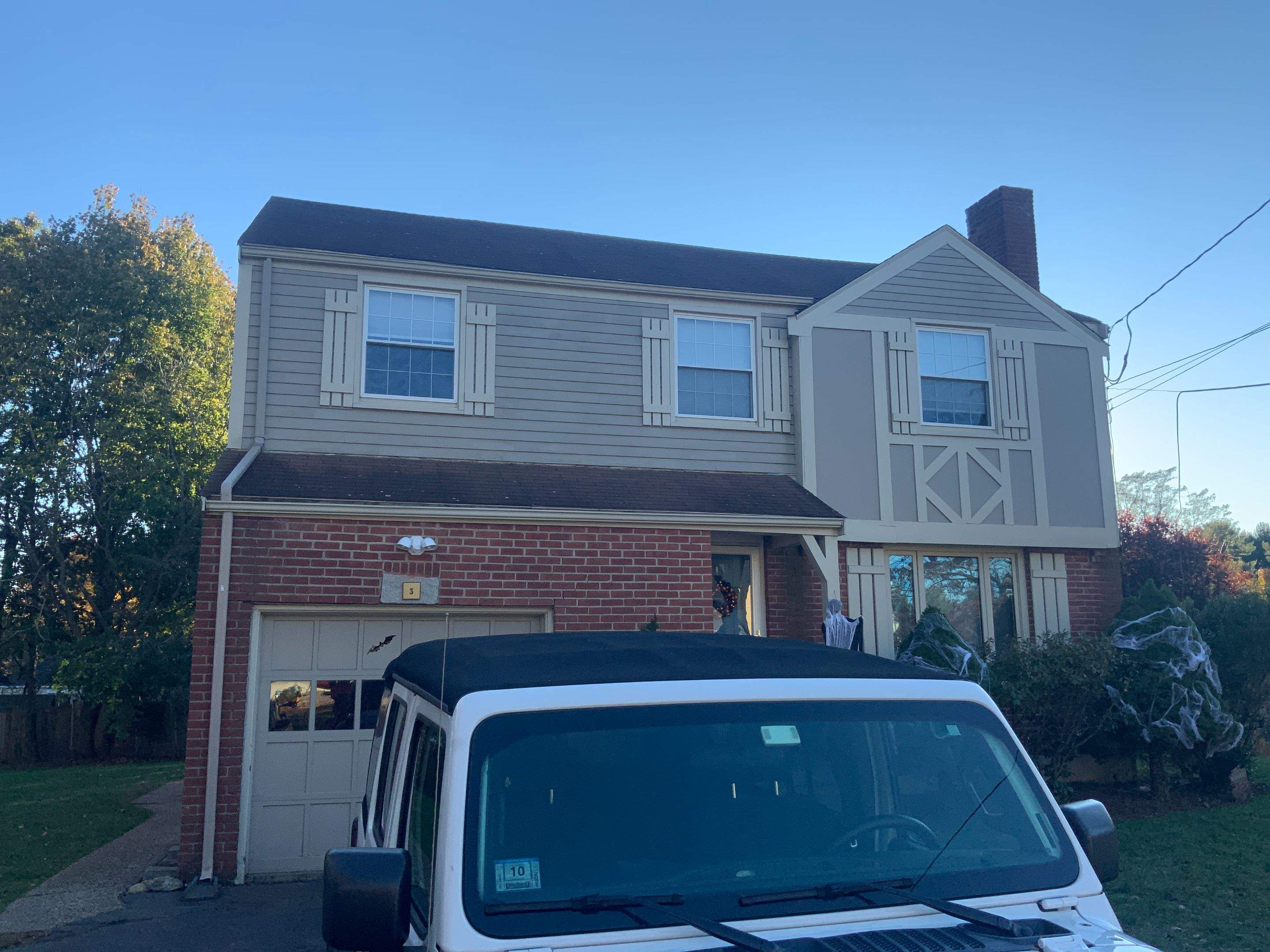 James Hardie siding, new metal roof and couple windows being installed. by UBrothers Construction