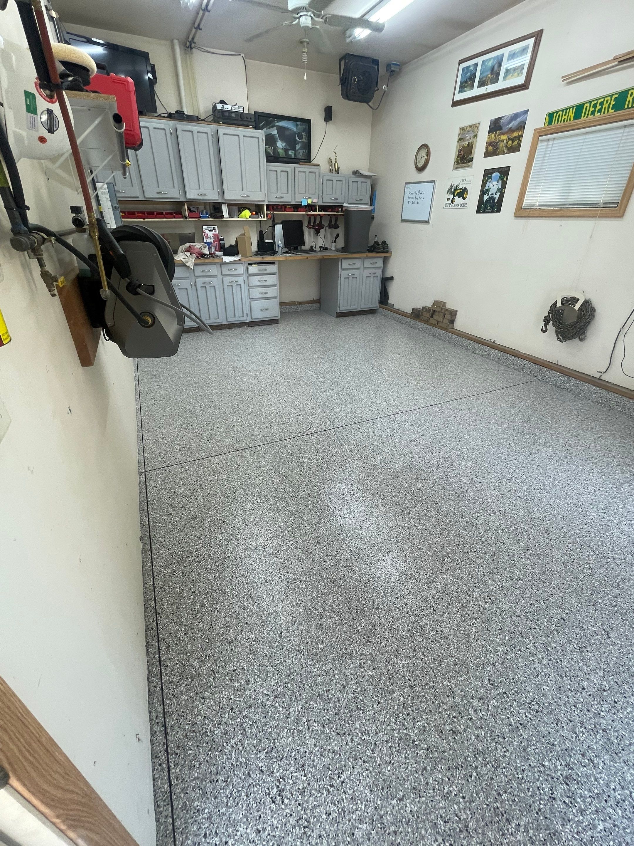 Multi-Stall Garage Floor Coating Installation in Sioux Falls by Select Painting, Coatings & Garage Cabinets