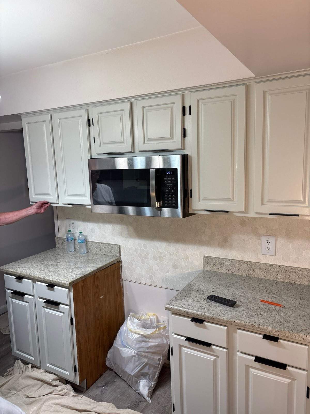 Two-Tone Kitchen Cabinet Refinishing and Granite Countertop Installation by Top Shelf Painter