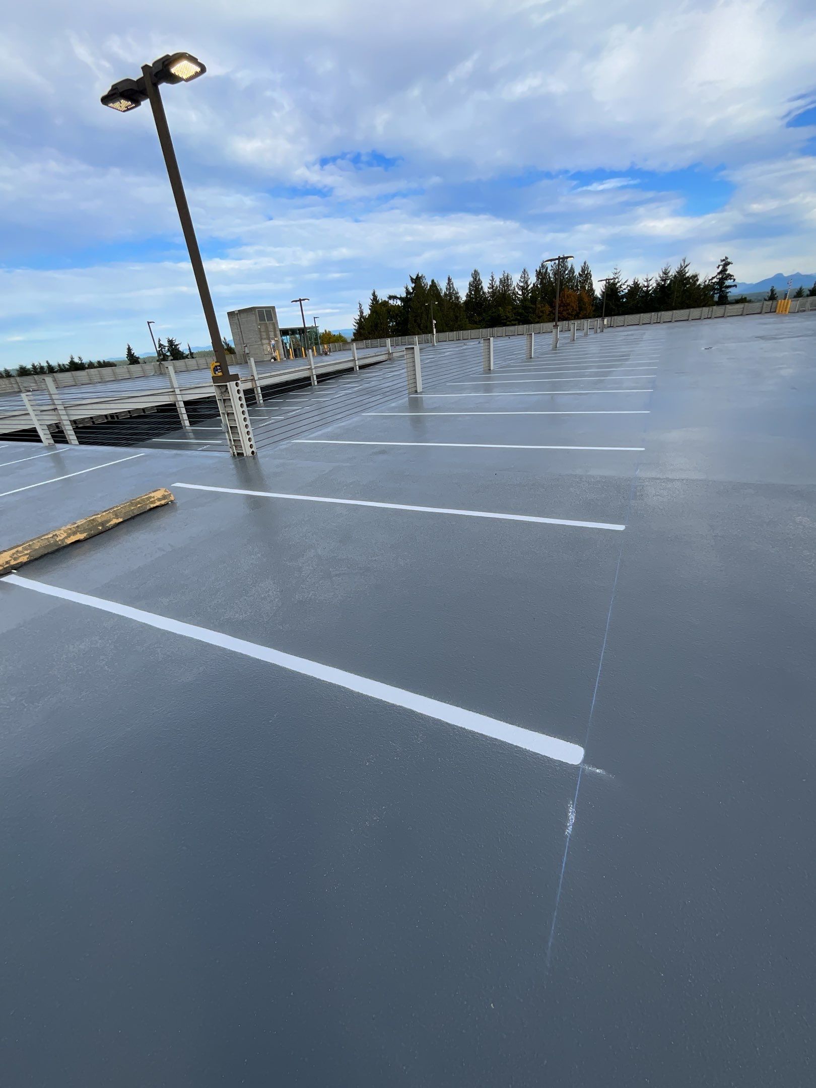 Corti Construction | Striping for Concrete Parking Lot by Jireh Asphalt & Concrete Inc 
