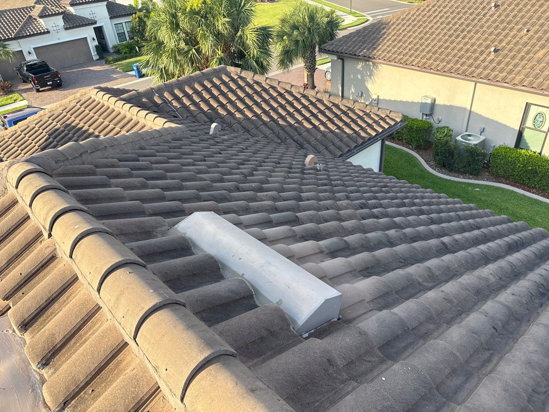 Soft Wash Roof Cleaning – Concrete Tile Roof | Artisan Lakes Esplanade, Palmetto, FL by Sunshine AquaWash