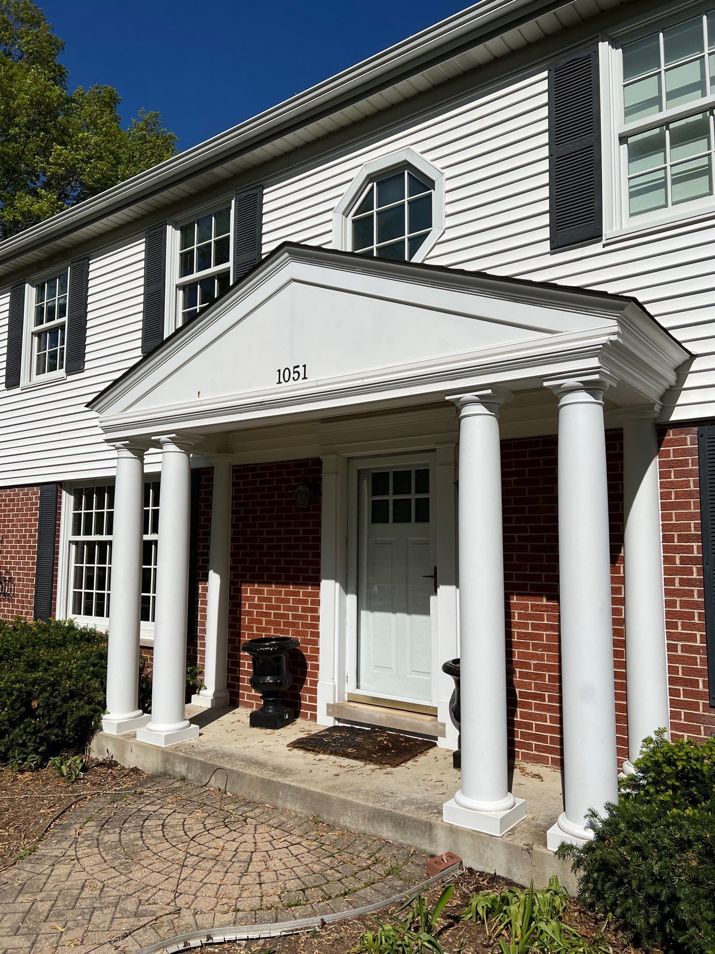 Housewashing  using Algaecide, soft wash soap by Northern Power Washing LLC.