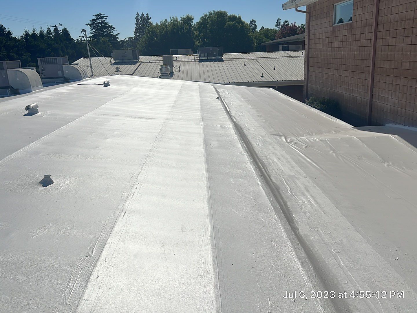 MR Roofing system using Benchmark/PUMA XL coatings over TPO single-ply roofing by Straight Edge Roofing Inc