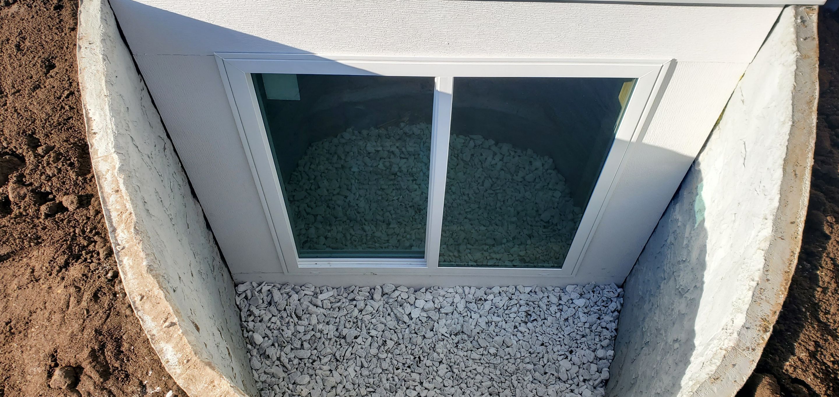 Egress Window Installation using Rockwell Egress Fiberglass Egress Window Well by Toledo Basement Repair 
