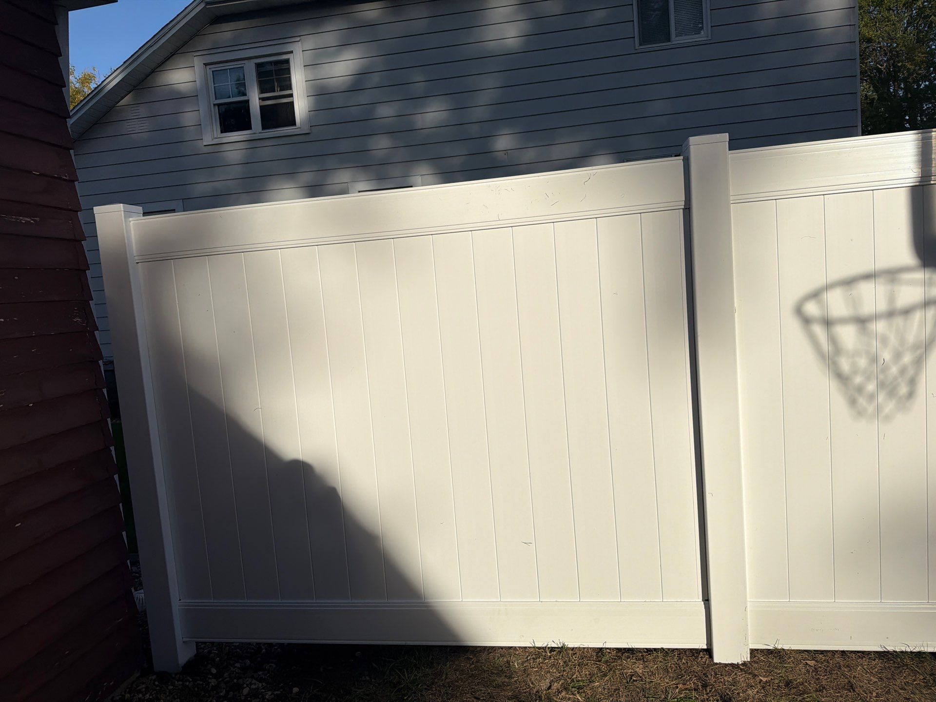 White Vinyl Privacy Fence and Gate Installation in Grundy Center by Perfect Picket Fence and Stain