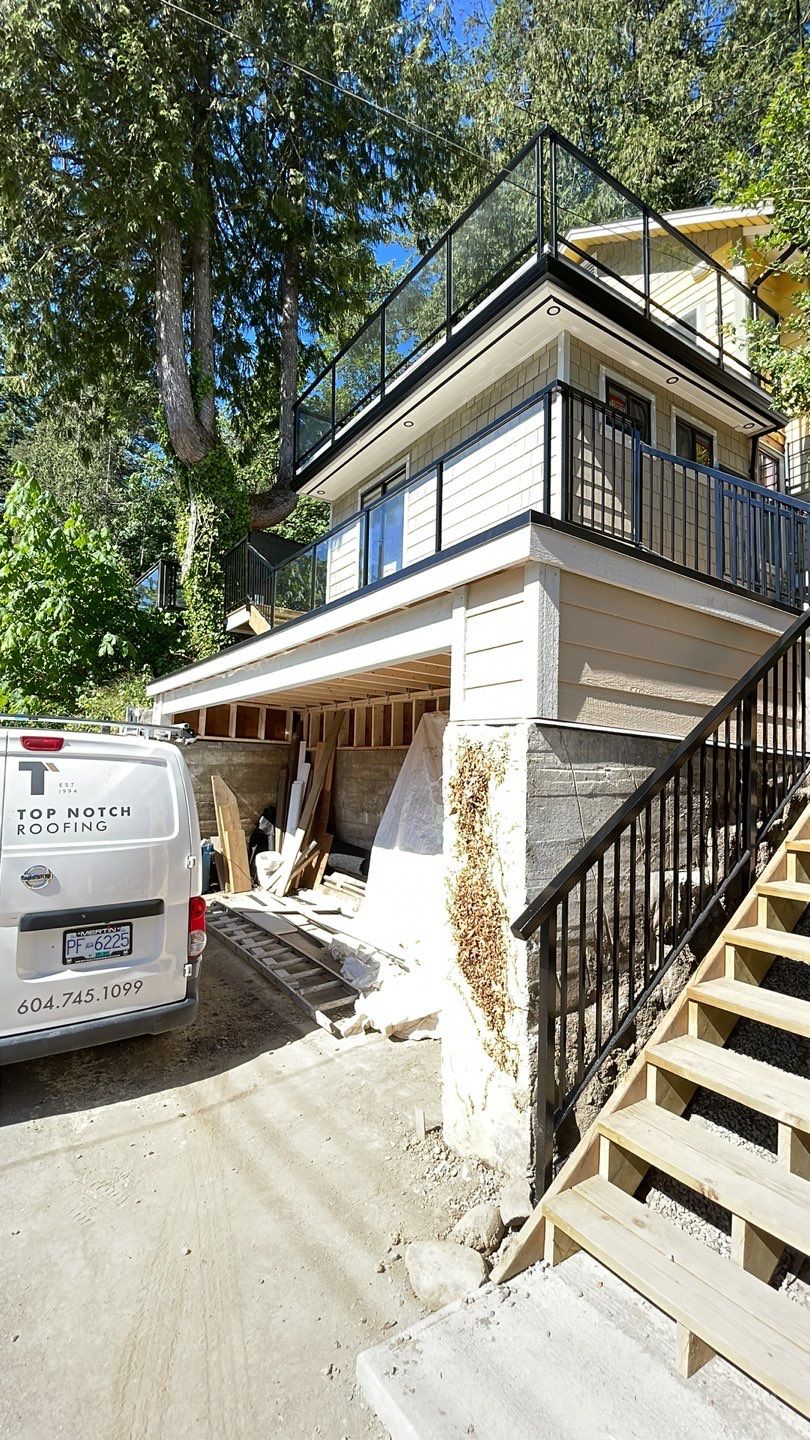 Small patio roof with 2ply sbs  by Top Notch Roofing Inc