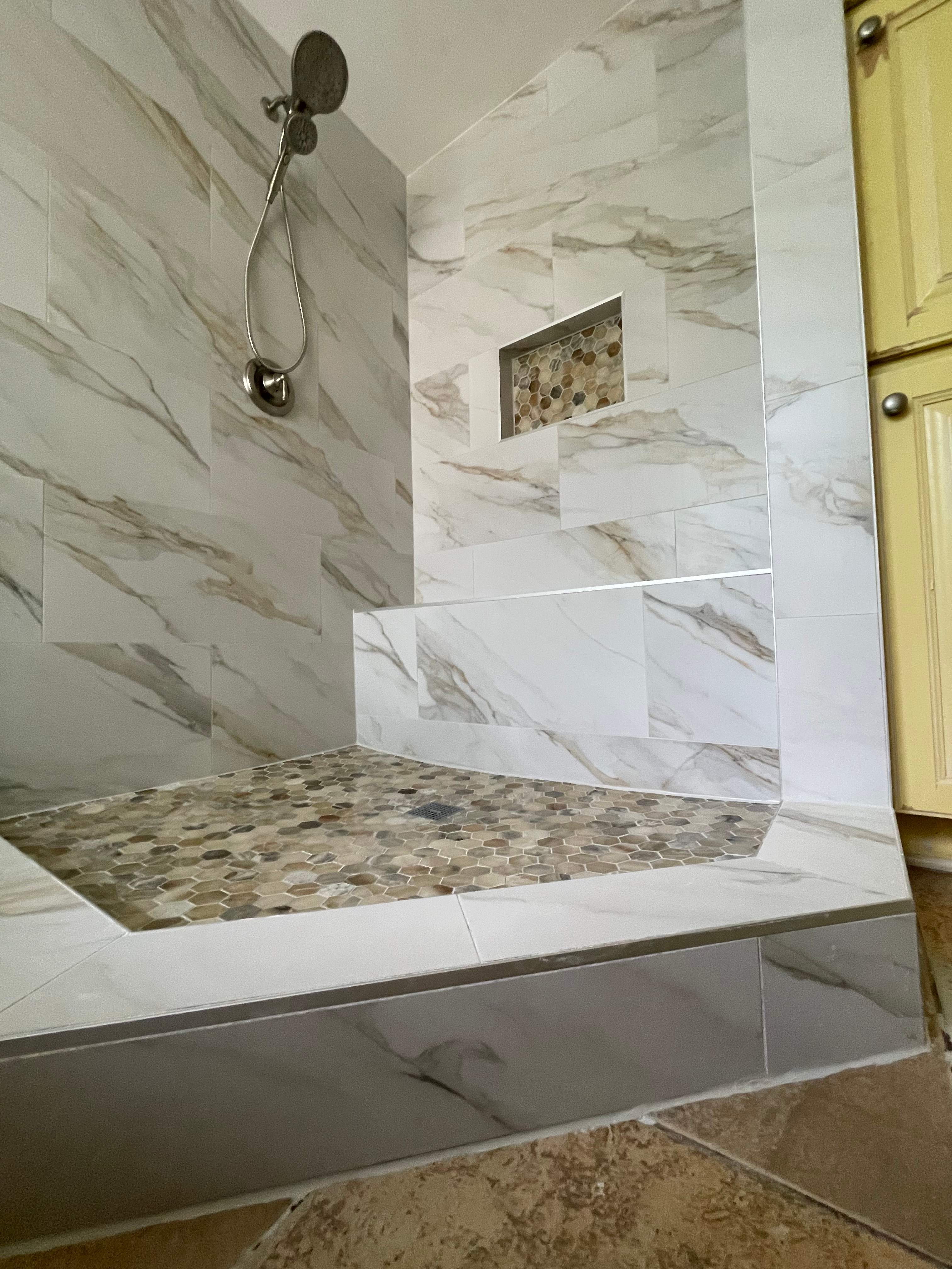 Master bathroom shower renovation, and tile flooring by Prudencio