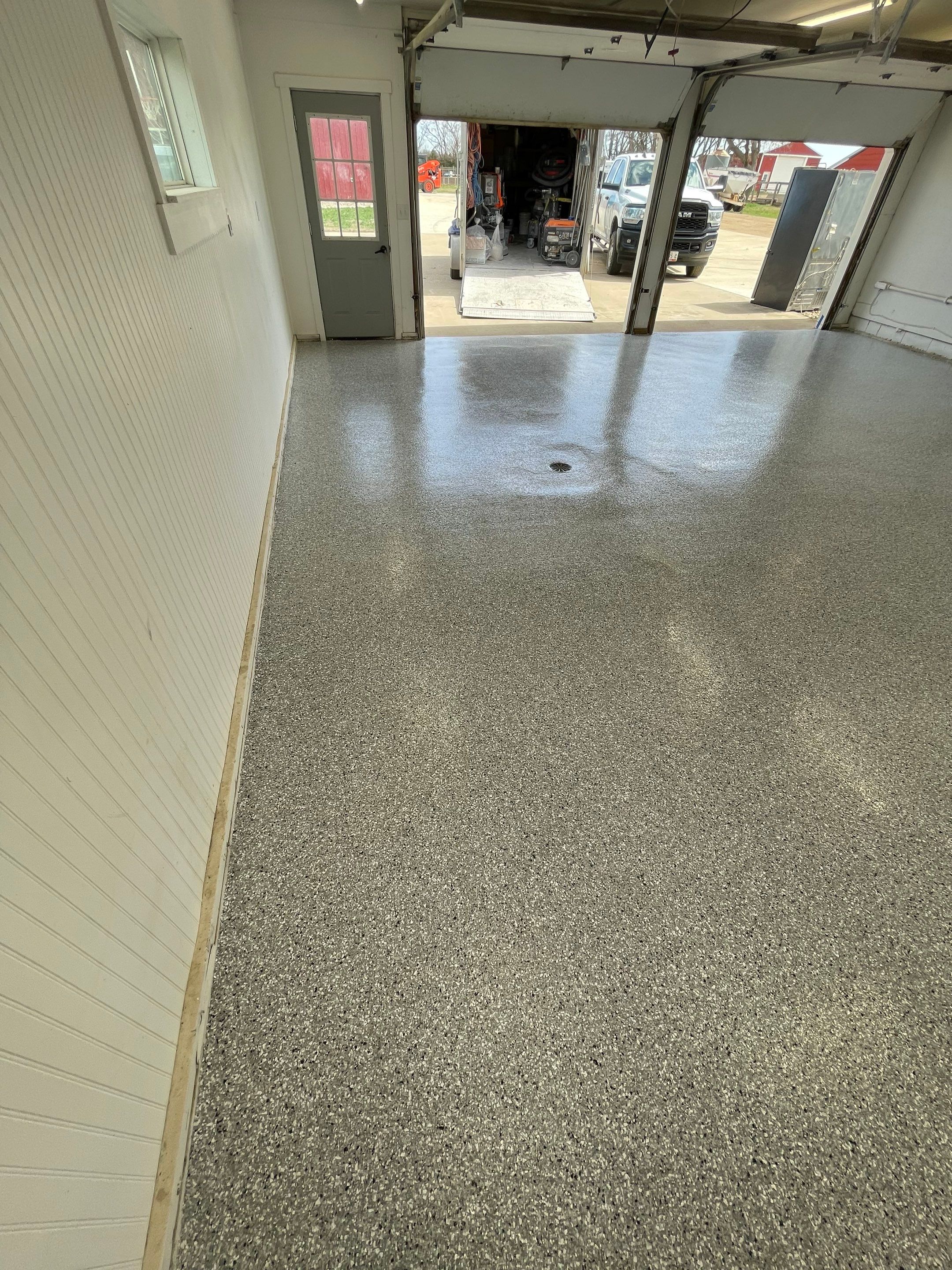 Feather Grey Garage Floor Coating and Crack Repair in Beresford by Select Painting, Coatings & Garage Cabinets