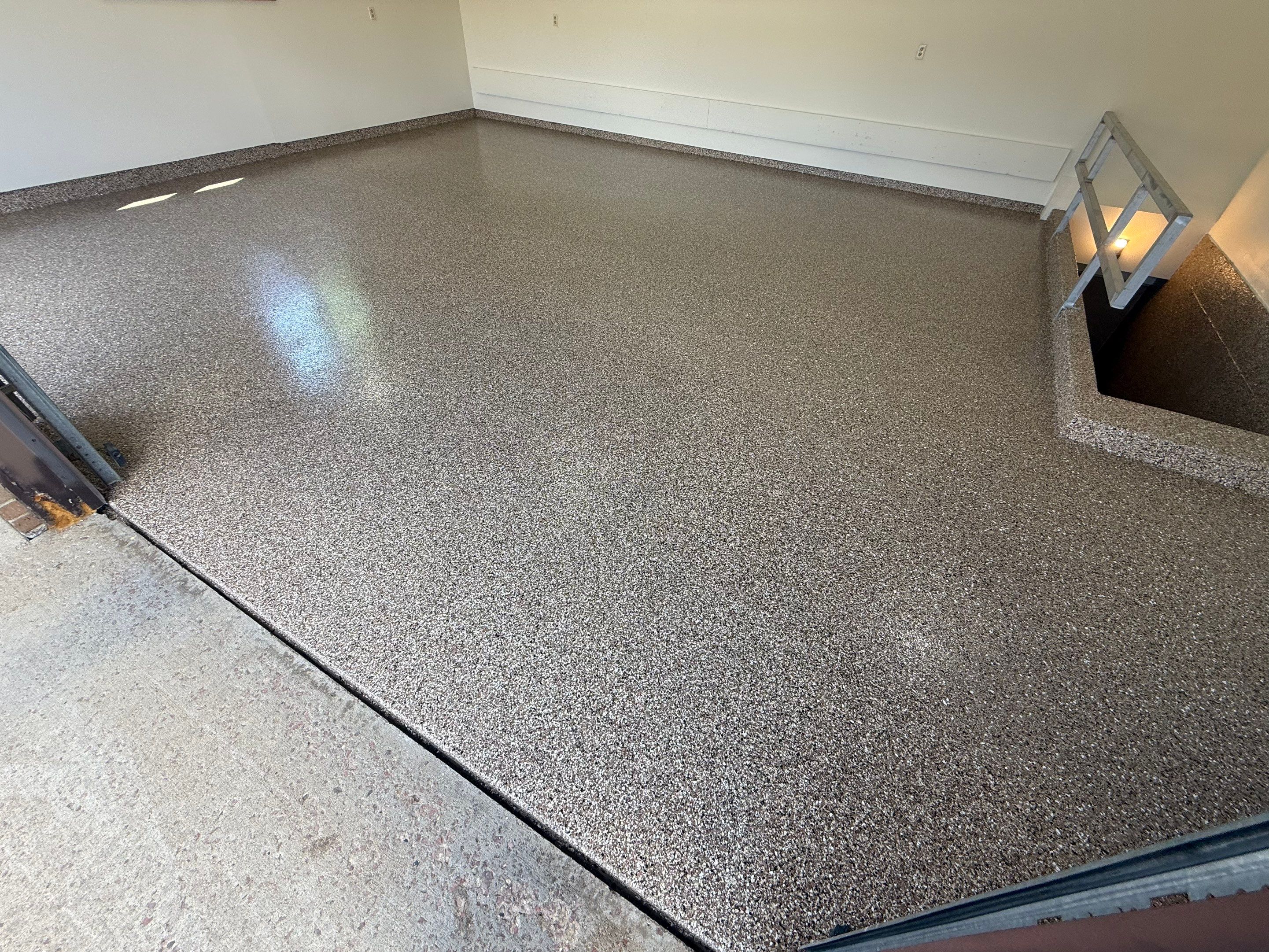 Custom Polyaspartic Garage Floor and Stairwell Coating in Pipestone by Select Painting, Coatings & Garage Cabinets