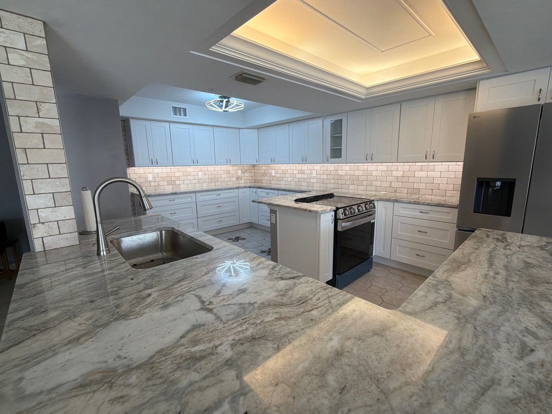 Completely Re-imagined Modern Condominium Kitchen Remodel  by Acies Renovations