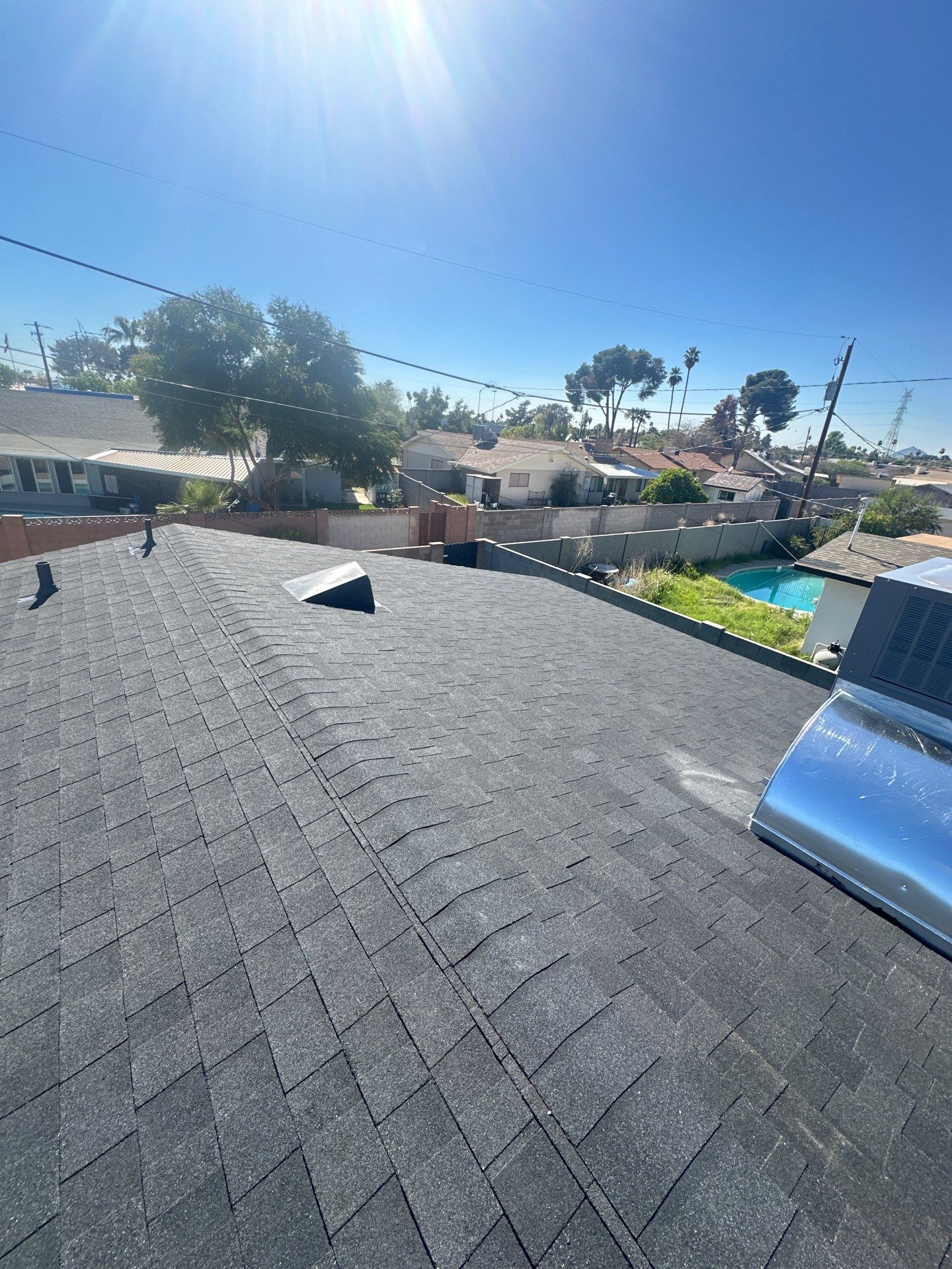 Onyx Black Shingles by Reimagine Roofing
