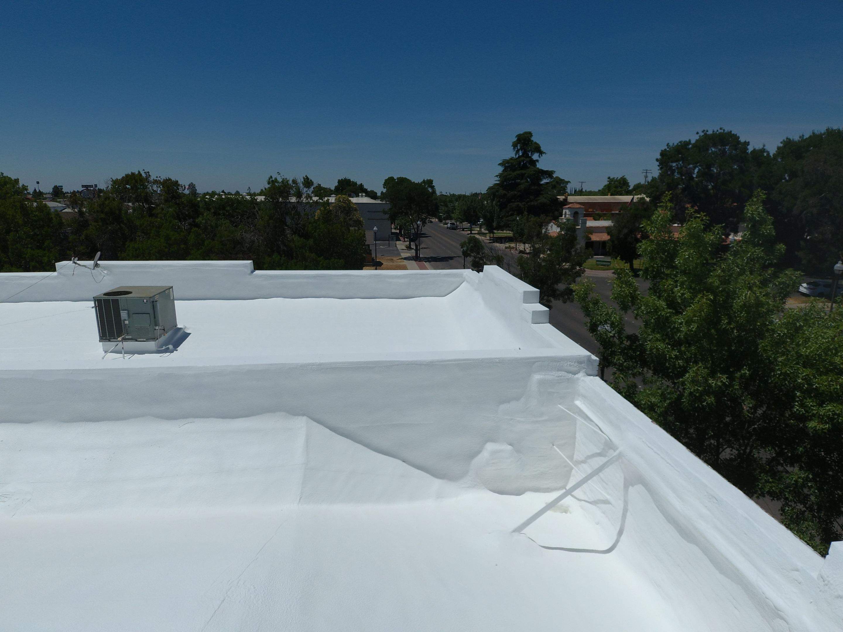 Spray foam and coatings using Conklin Benchmark/PUMA XL coatings and spray foam by Straight Edge Roofing Inc