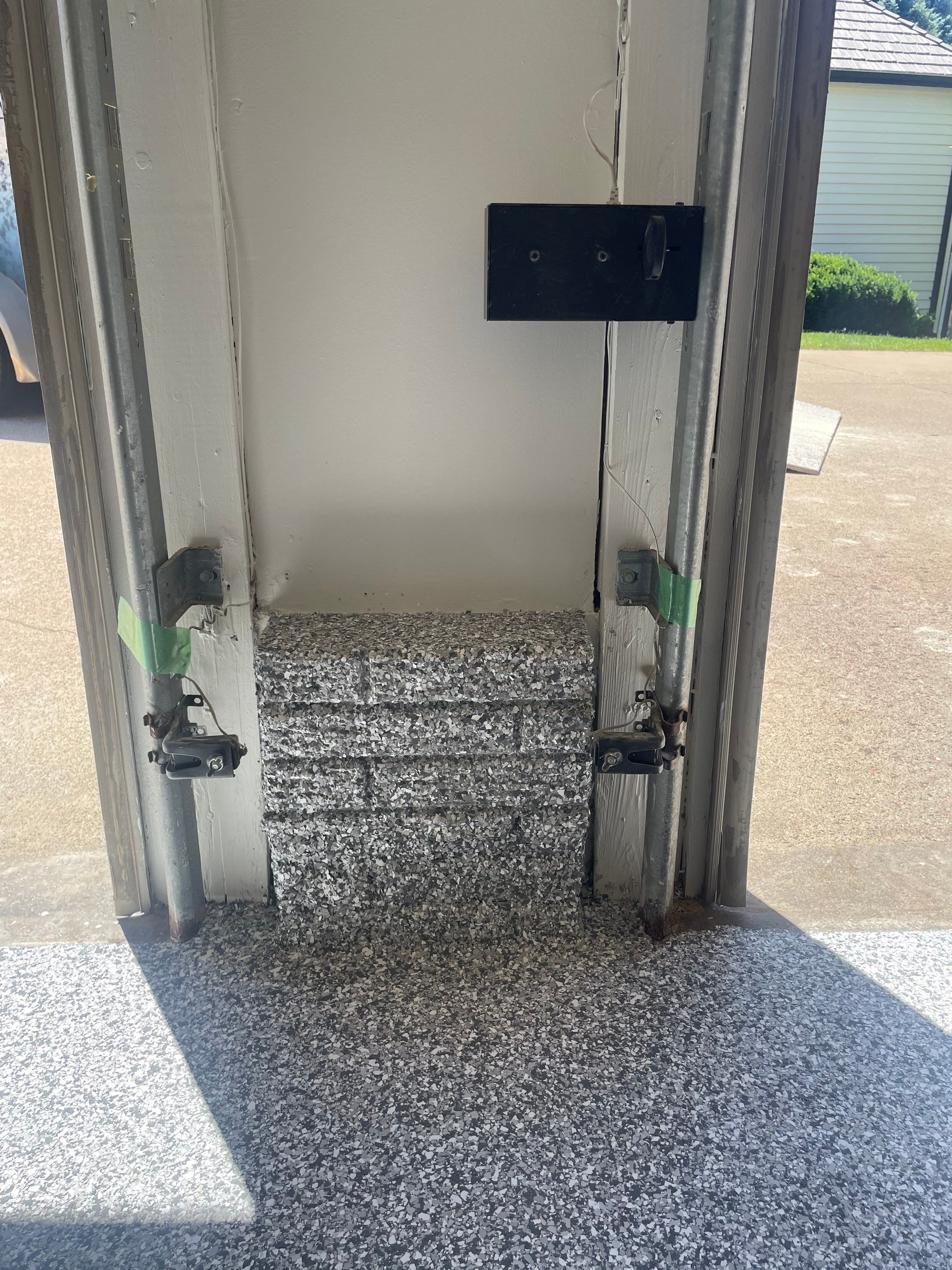 Gray Speckled Epoxy Garage Floor Coating in Sioux Falls by Select Painting, Coatings & Garage Cabinets