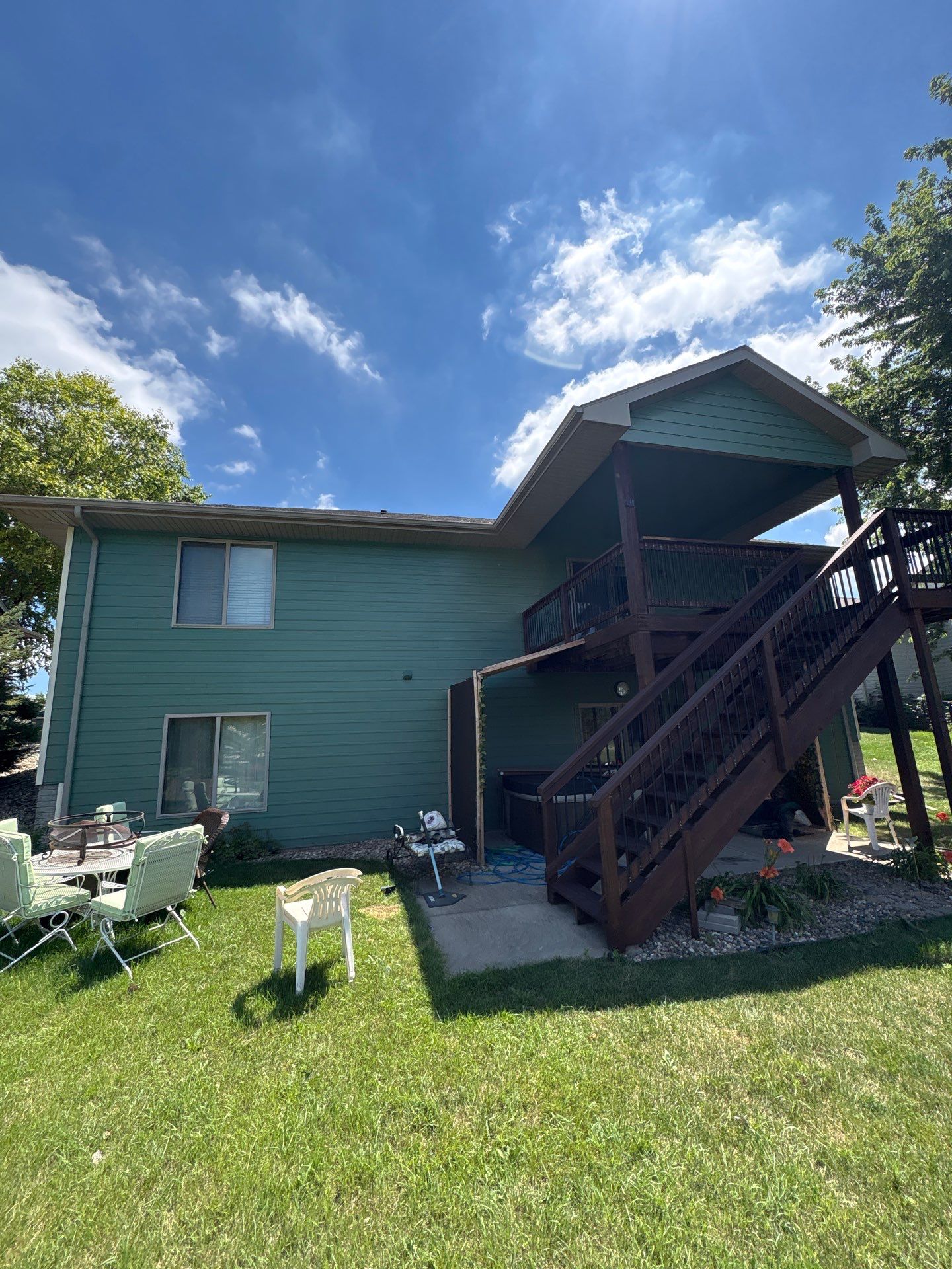 Full Exterior Residential Painting and Siding Refresh in Tea by Select Painting, Coatings & Garage Cabinets