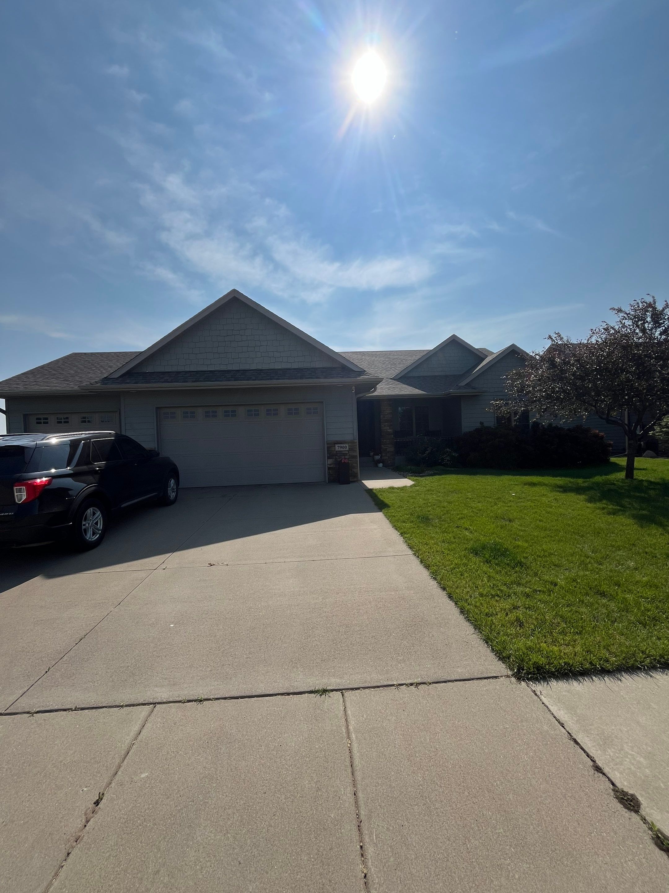 Sioux Falls Residential Exterior Refresh with Fiber Cement Siding by Select Painting, Coatings & Garage Cabinets