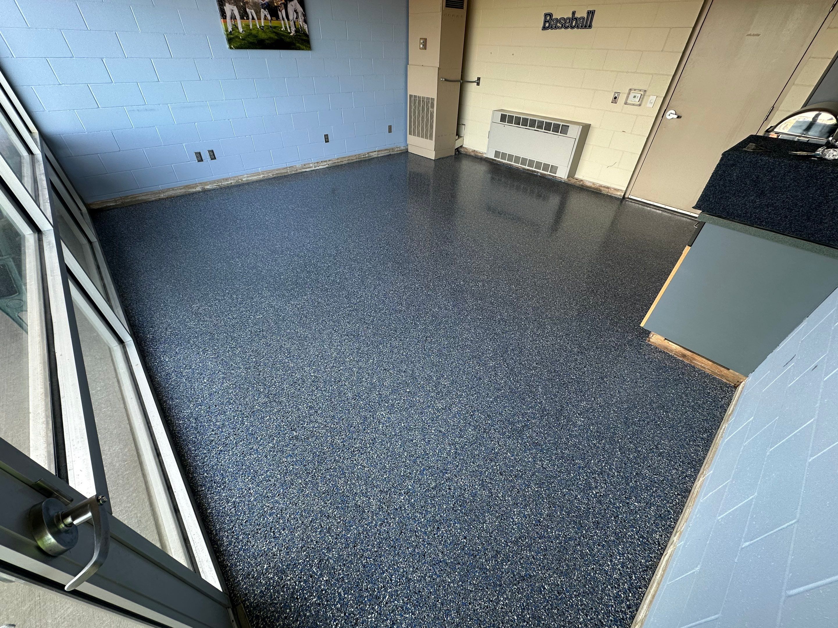 Commercial Epoxy Floor Coating for Stadium Viewing Suites in Sioux Falls by Select Painting, Coatings & Garage Cabinets