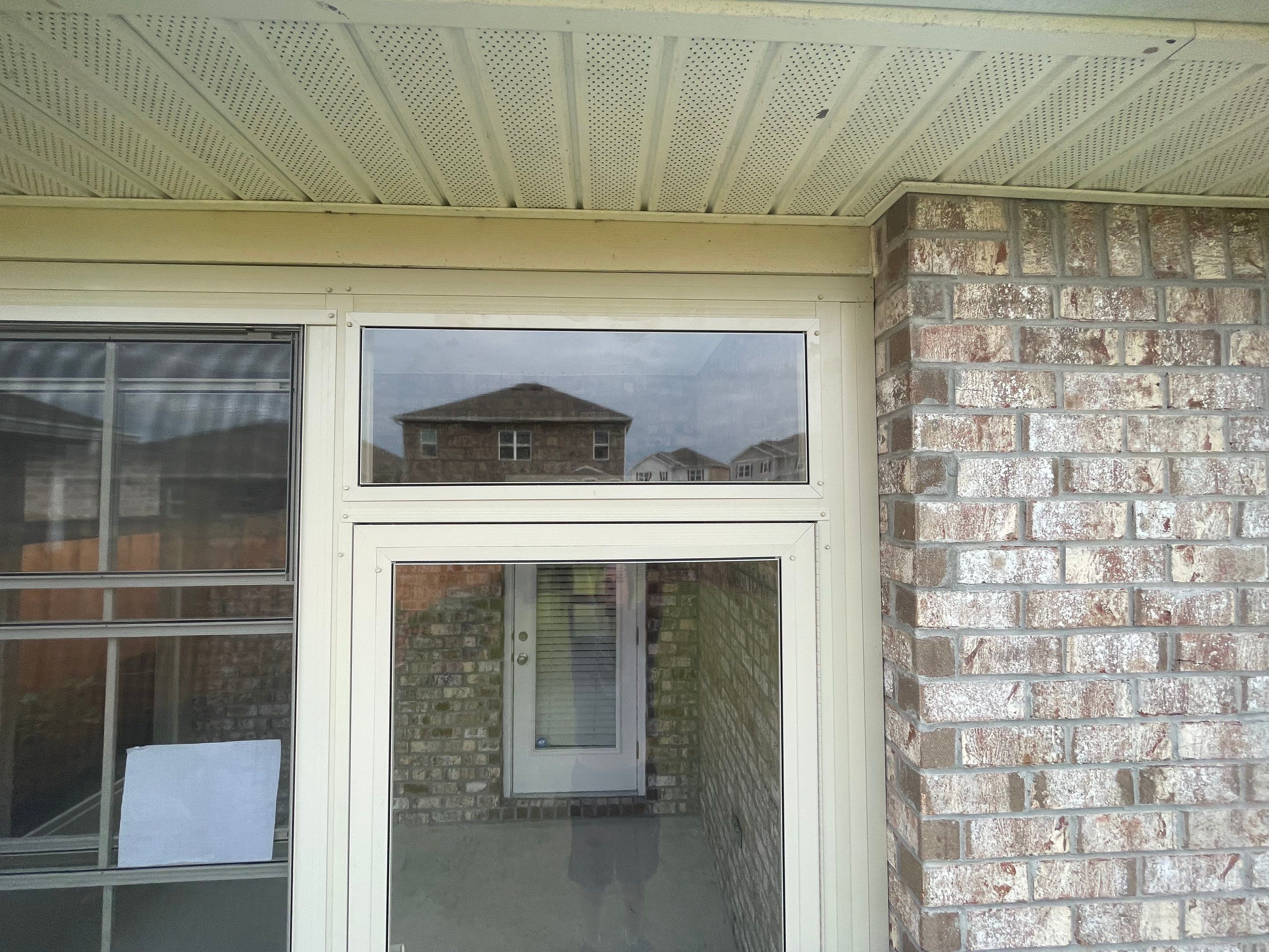 Panama City Glass Room Under Existing Patio Cover by Titan Sunrooms