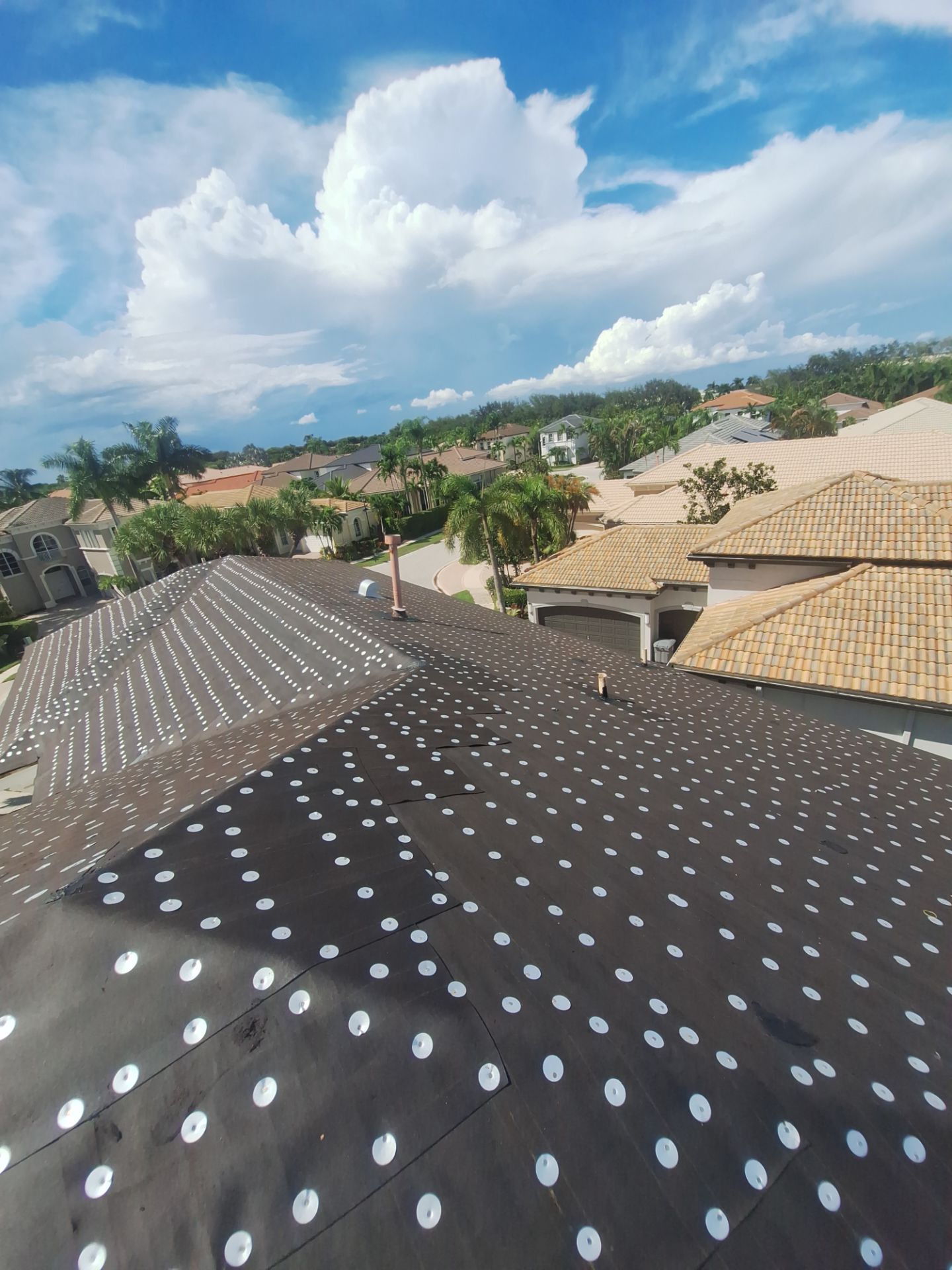 Residential Roofing Installation using 1" Nail strip metal roof by BLUES BROTHERS CONSTRUCTION CORP