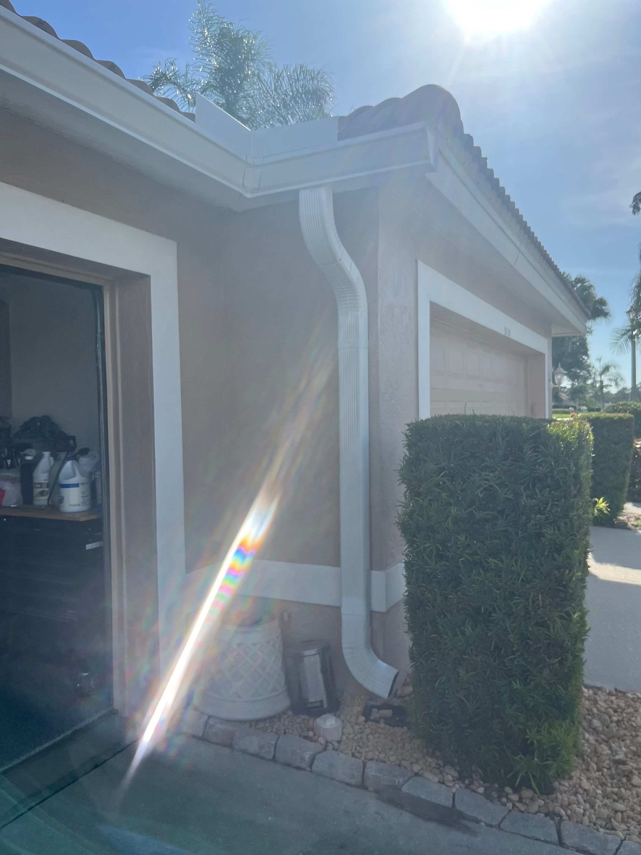 Replace White Seamless Gutters Installation in Sarasota FL by Gutter Professors