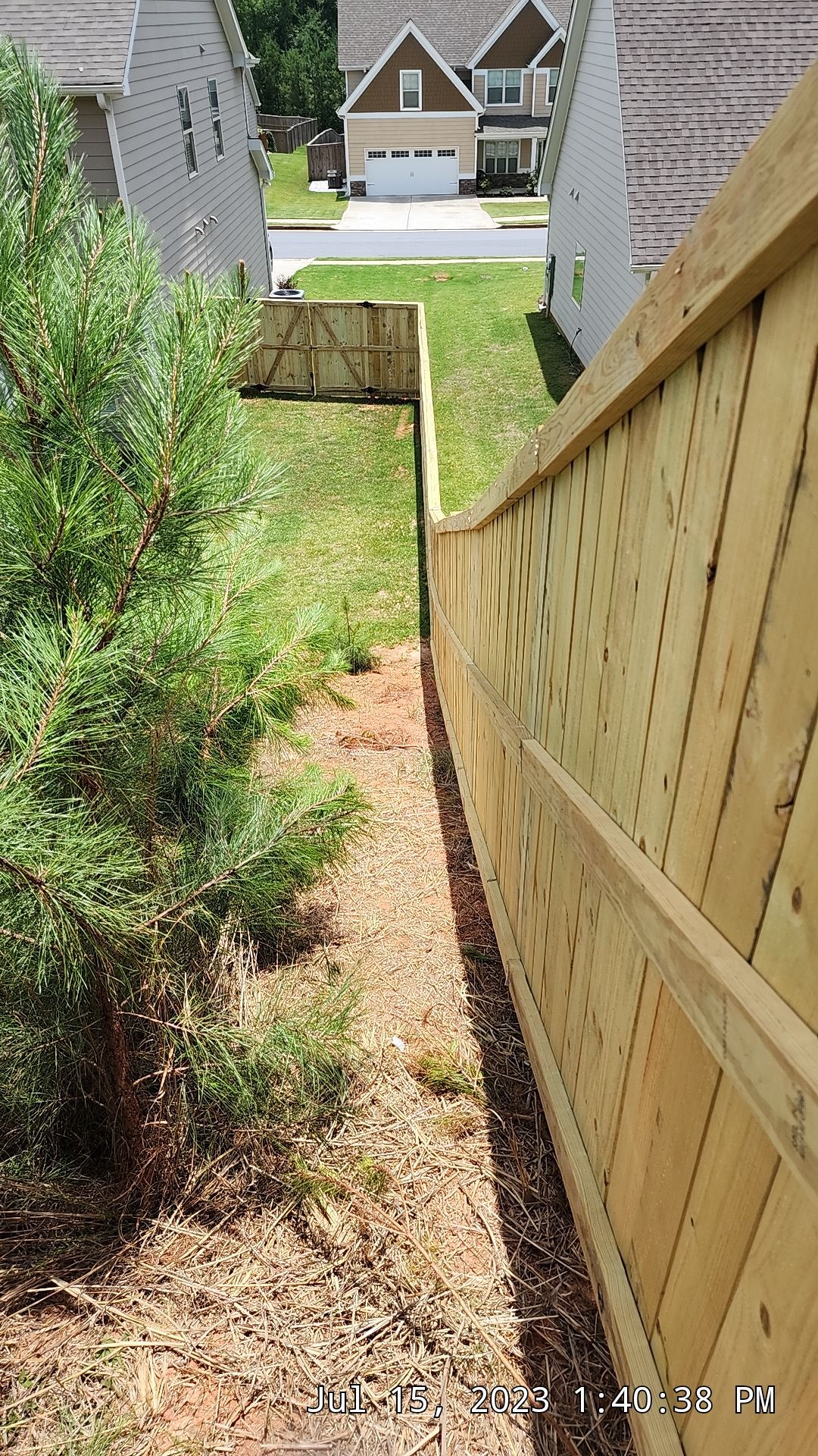 Fence Installation of Capped Wood Privacy by Titans of Timber Fence & Stain