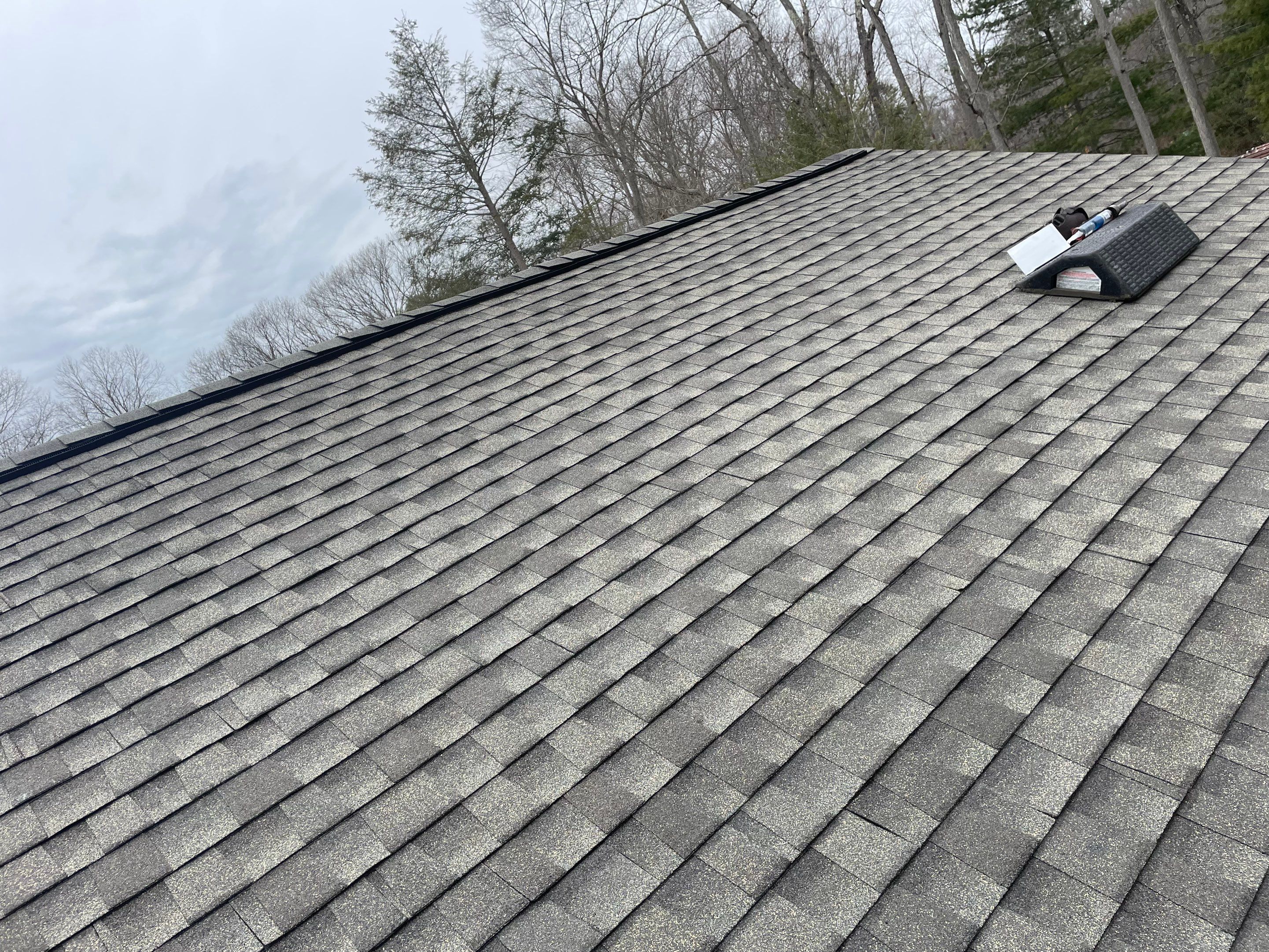 Asphalt shingles meet sleek siding in Guilford. by DiGiorgi Roofing and Siding Inc