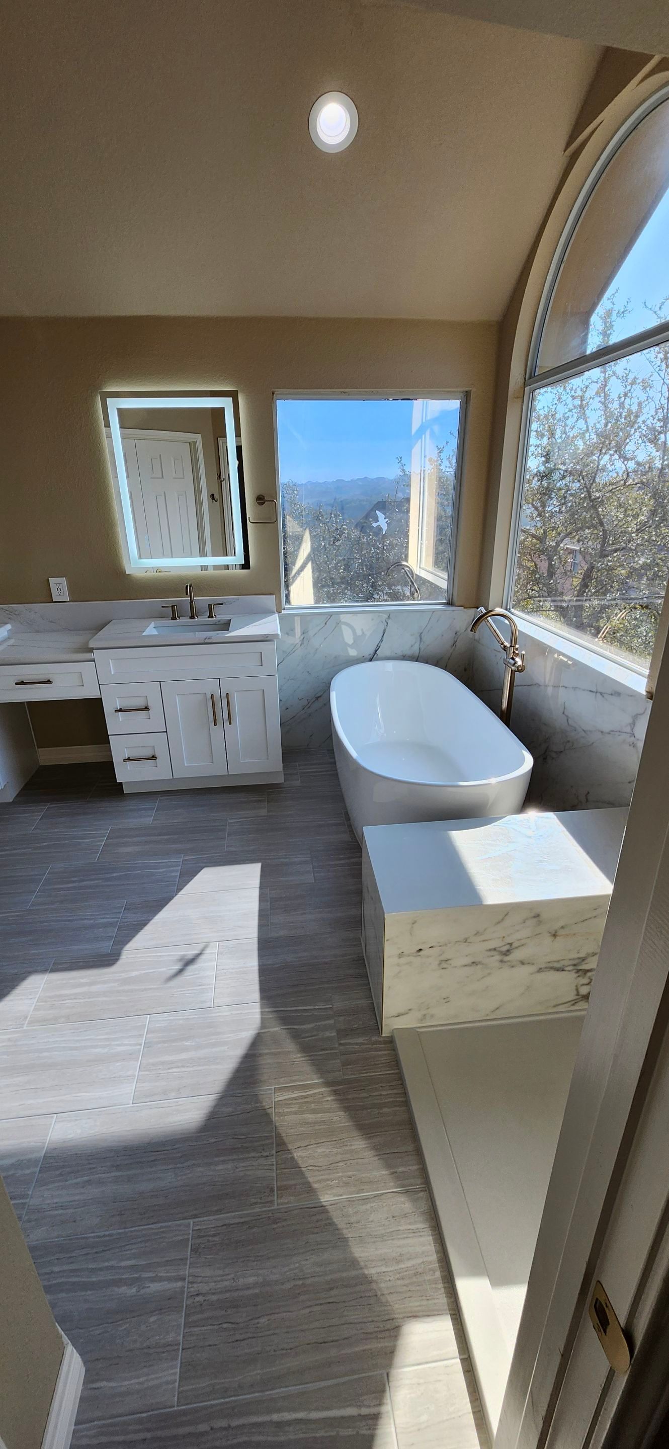 Stone Oak Bathroom Remodel with Freestanding Tub & Walk-In Shower by Legacy Bath and Kitchen