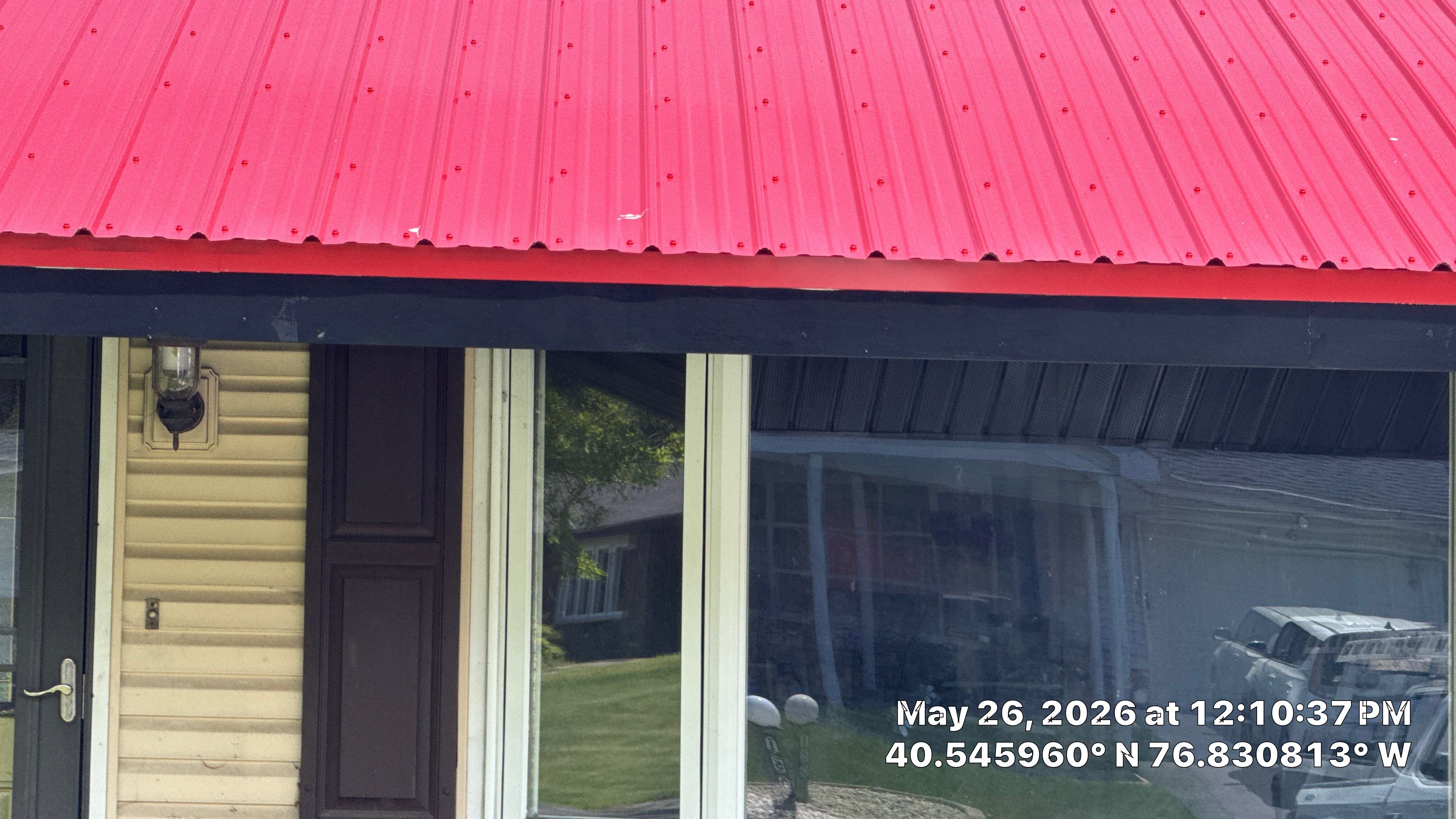 Red ABM Panel Metal Roofing Installation on Elizabethville Ranch Home by Esh Builders