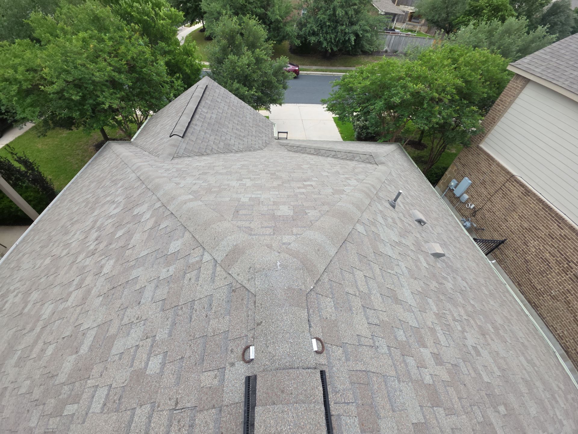 Comprehensive Residential Roofing Replacement and Gutter Restoration in Round Rock by Caliber Restoration LLC