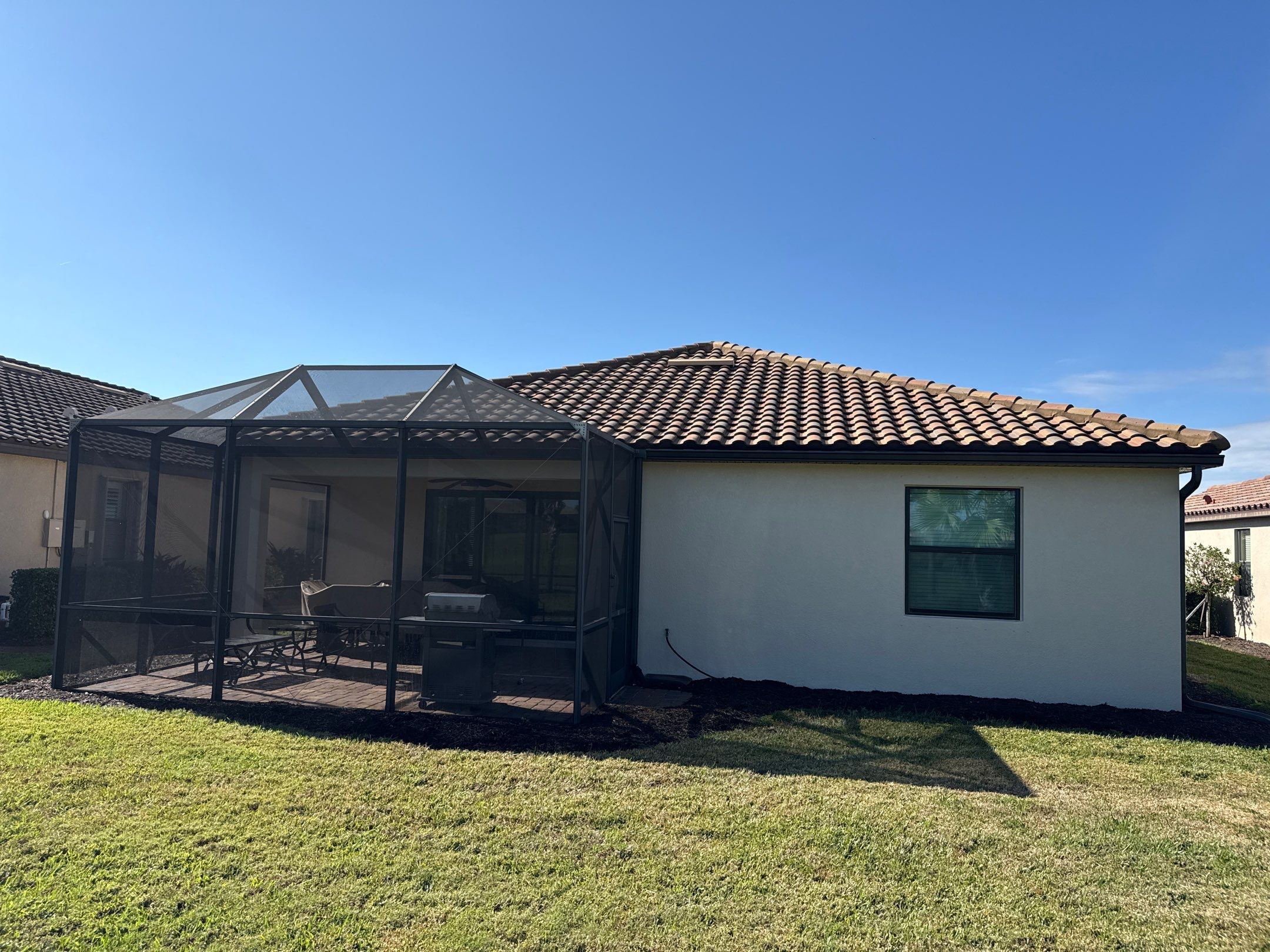Barrel Tile Roof Cleaning & Paver Driveway Cleaning in River Strand at Heritage Harbour | Bradenton, FL by Sunshine AquaWash