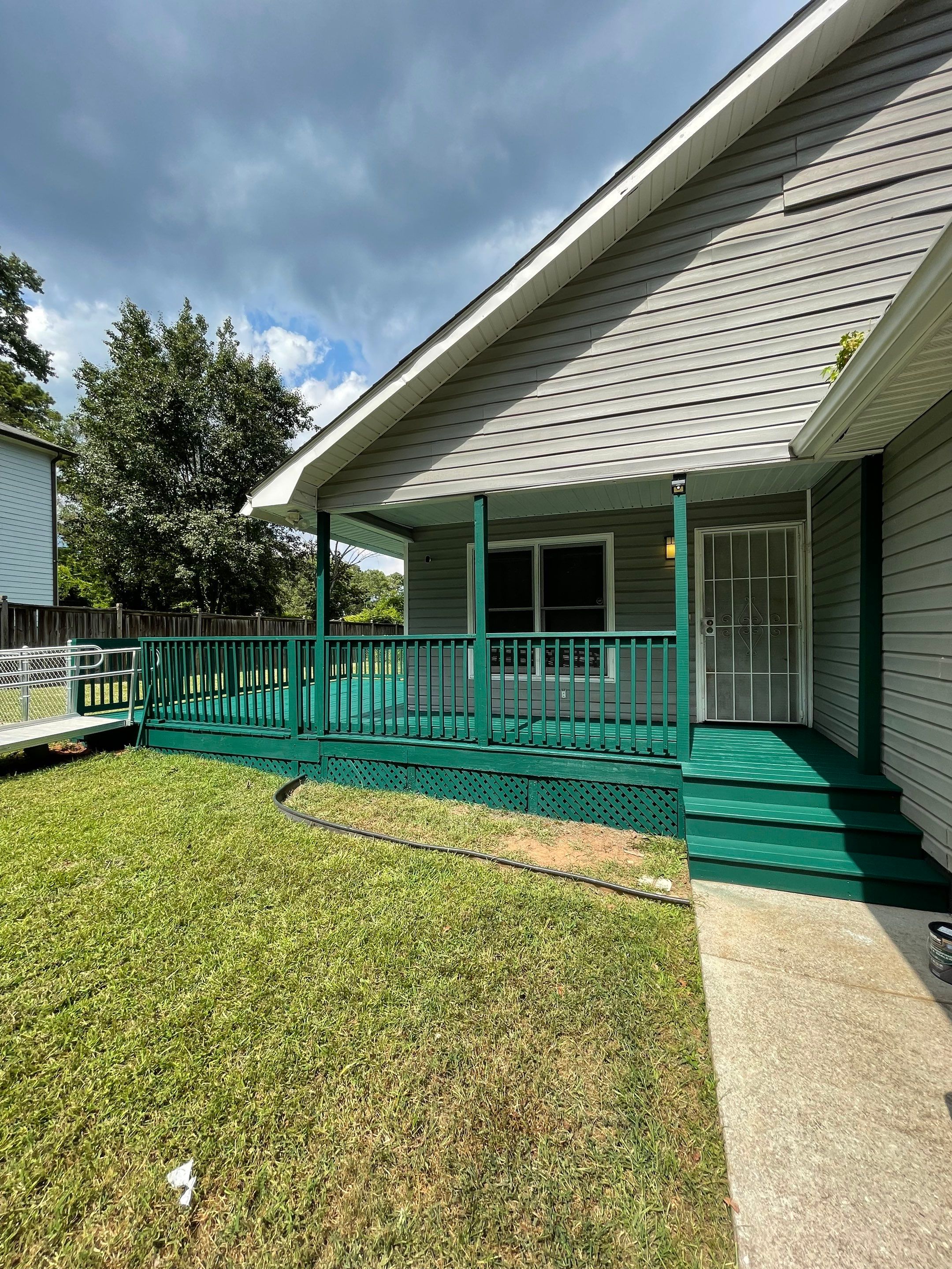 Deck Refinishing and Exterior Painting with Custom Green Finish in Decatur by Swift Home Renovations