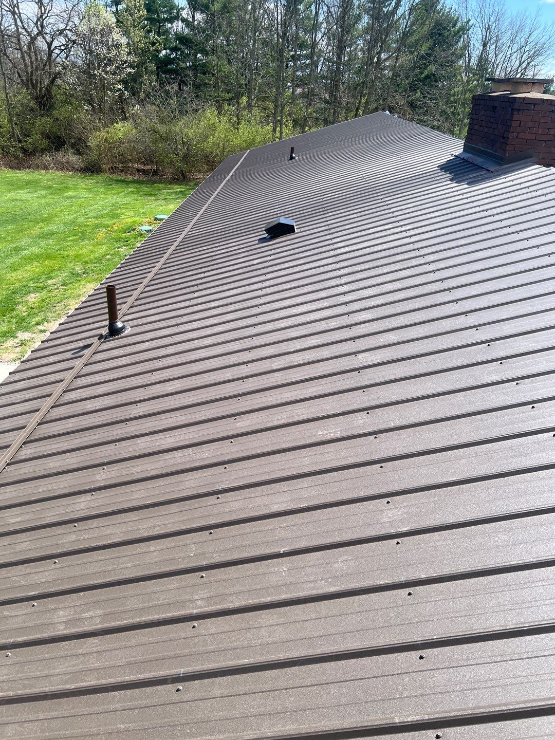 Residential Roofing Installation using Performance Panel Metal - Crinkle Bronze by RoofX 