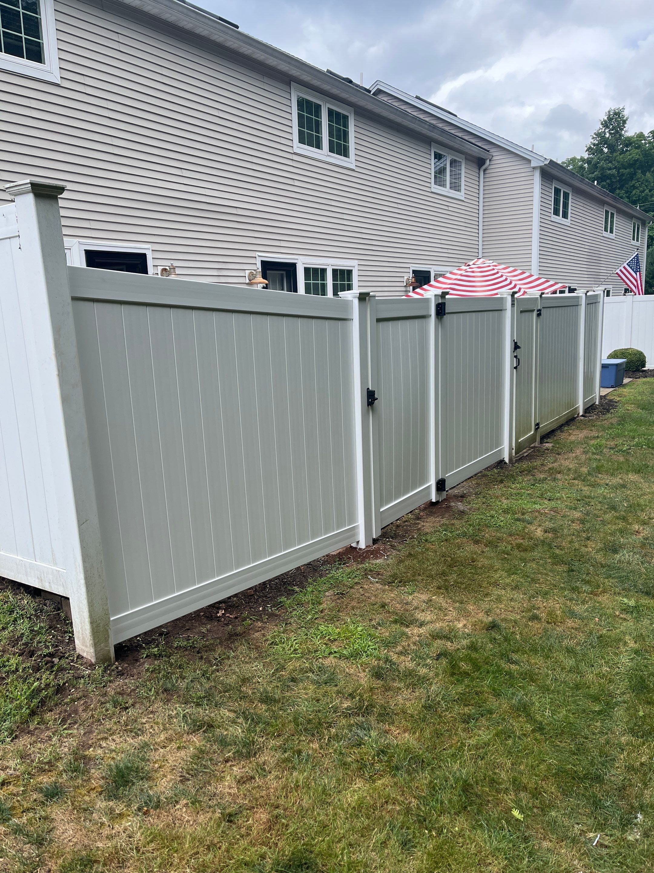 Vinyl privacy fence and matching gate  by DiGiorgi Roofing and Siding Inc