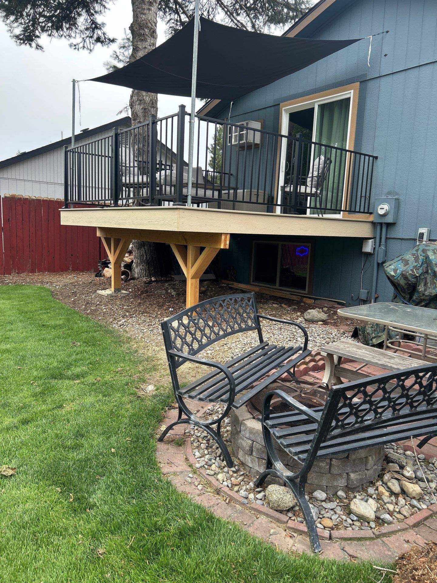 Add a platform deck below an existing elevated deck that was there prior by Home Helpers General Contracting