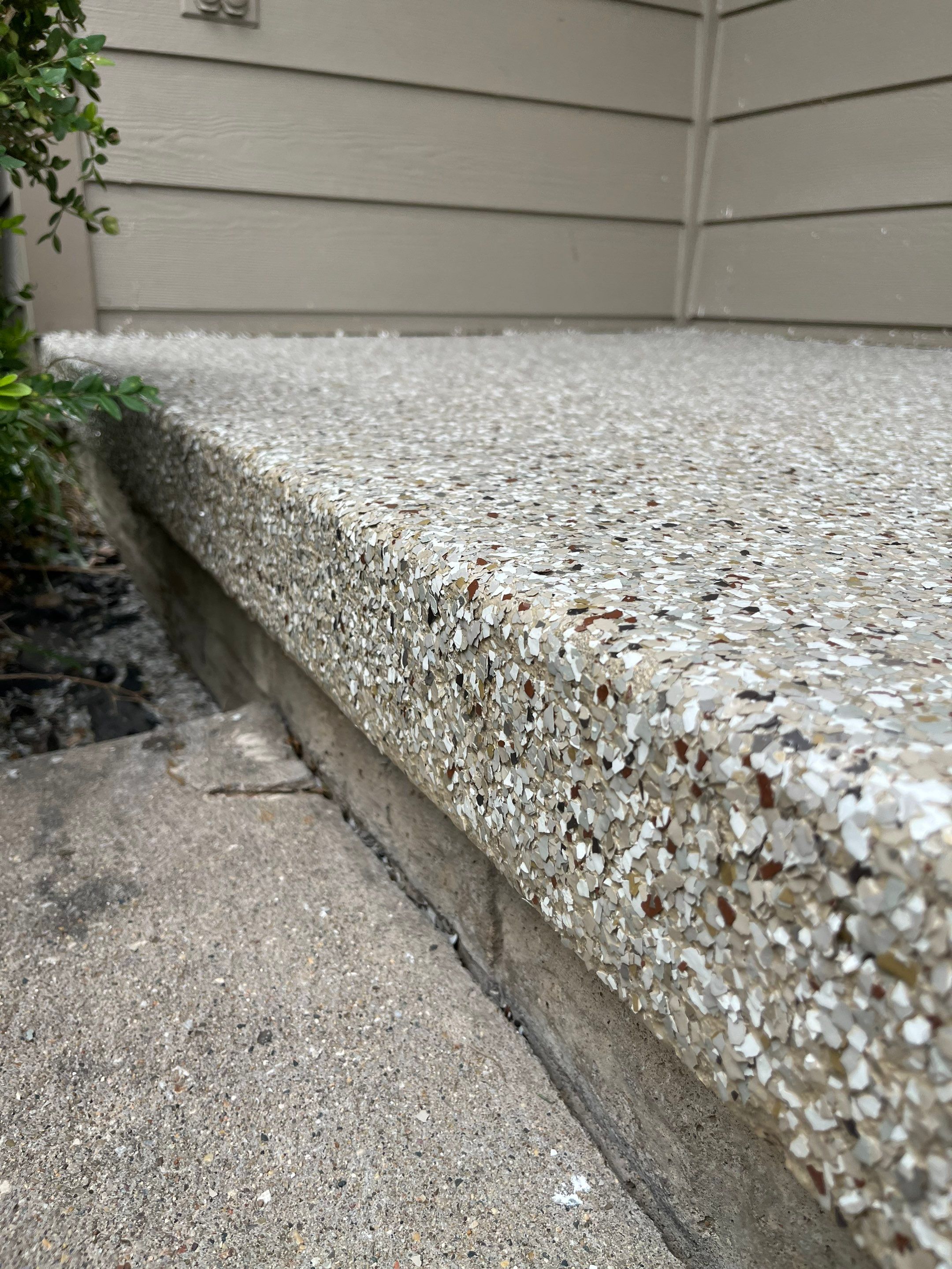 West Des Moines Garage and Patio Floor Coating using Pebble Beach Flakes by Revival Concrete Coatings