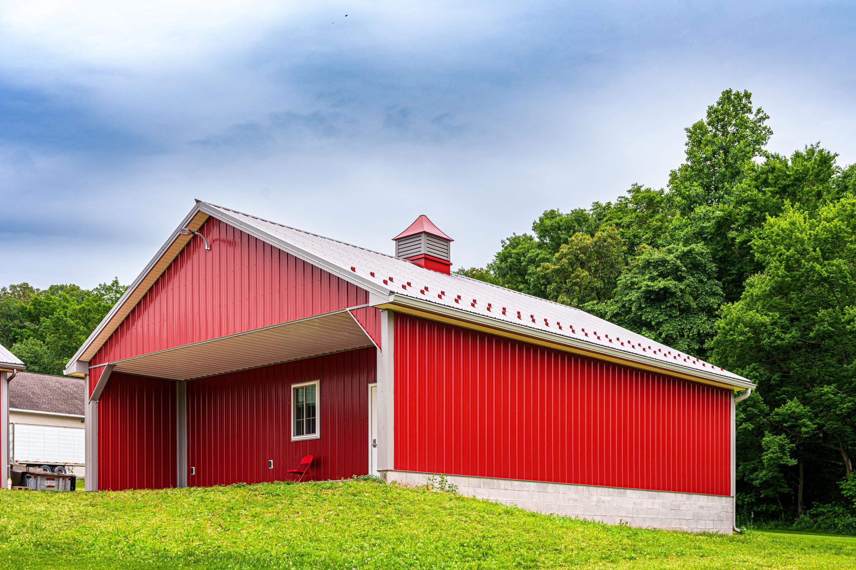 Metal roof -barn red, and New garage by Esh Builders