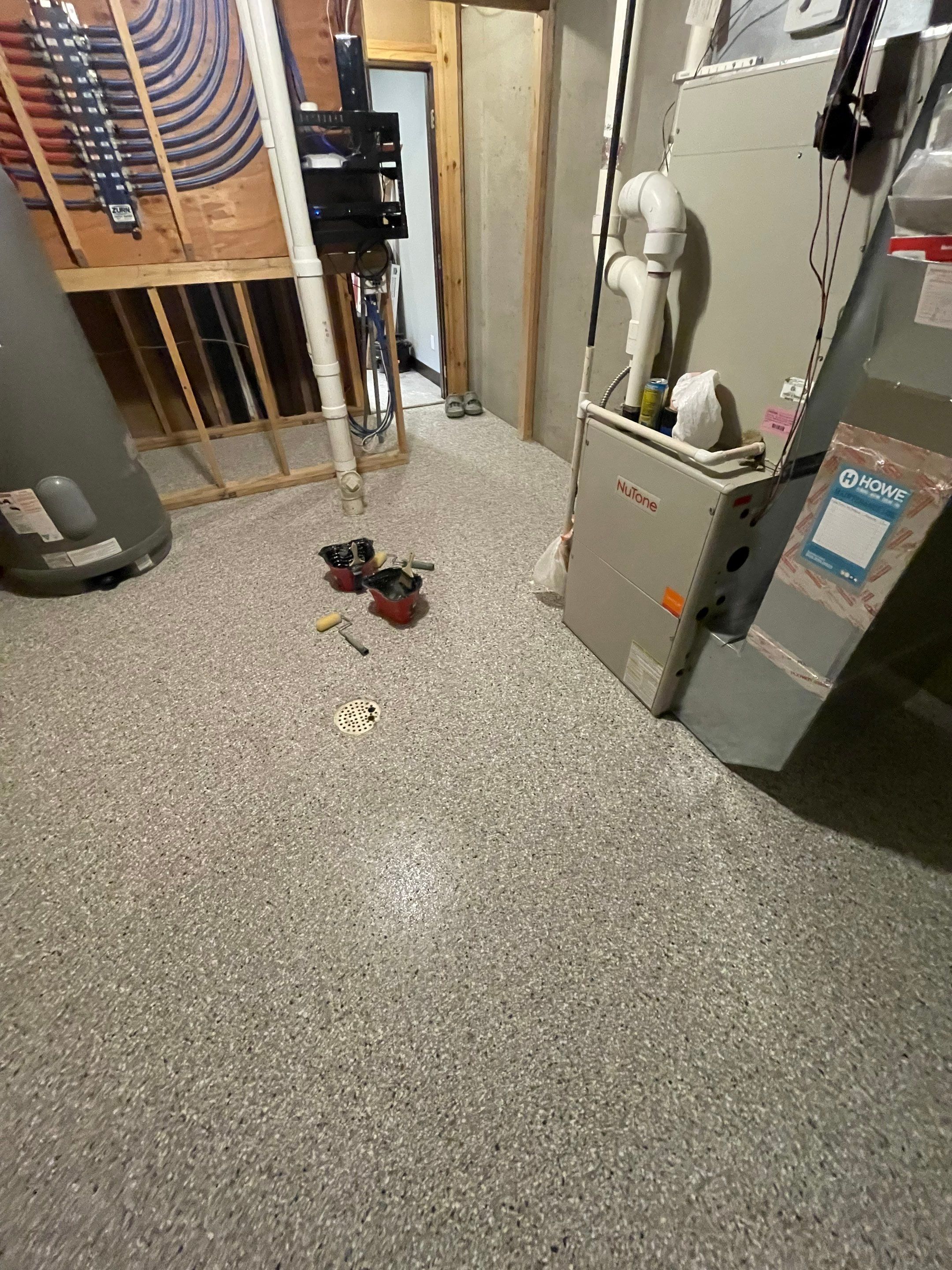 Sioux Falls Basement Floor Transformation with Durable Epoxy Flake Coating by Select Painting, Coatings & Garage Cabinets